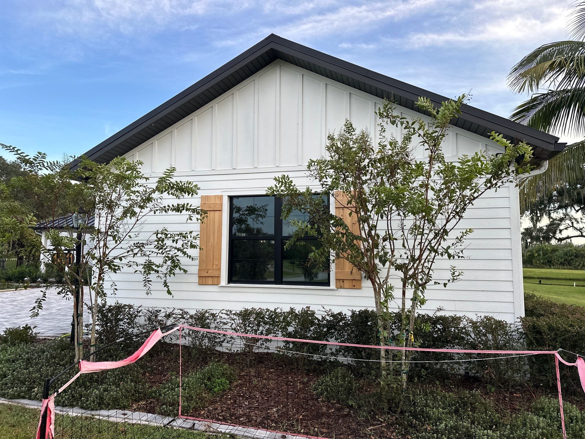Complete Two-Story House Wash and Driveway Cleaning in Winding River Community, Bradenton, FL by Sunshine AquaWash