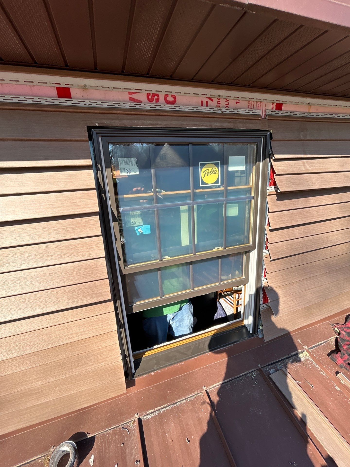 Pella Window installation using Pella Lifestyle wood/Aluminum window by United Windows and Siding LLC
