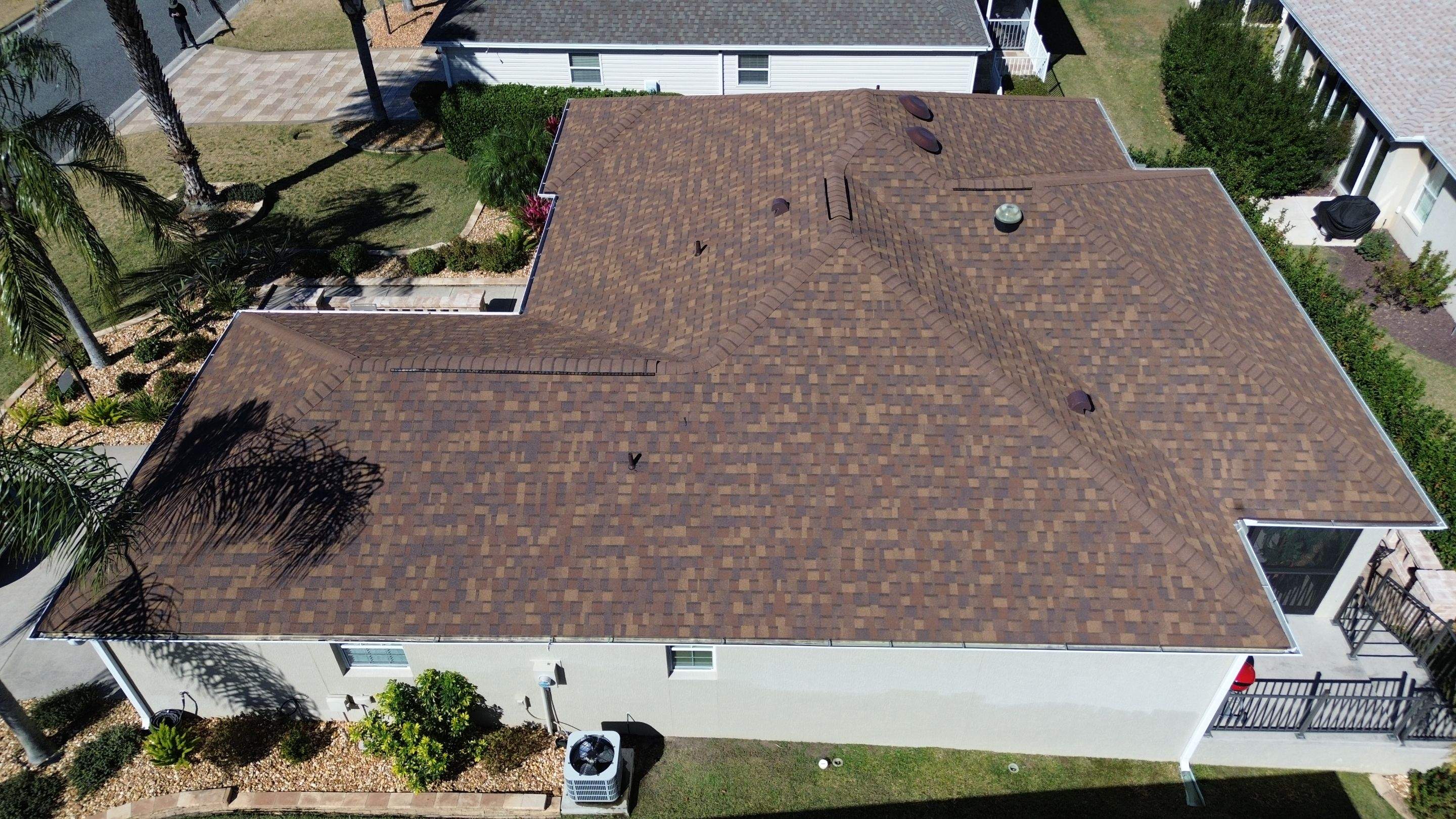 Florida roofers installing shingles by Brehm Roofing