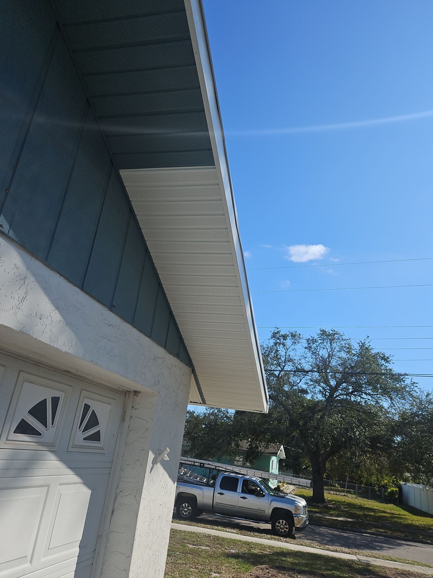 K-Style Seamless Gutter Installation using White Seamless Gutters in Sarasota FL by Gutter Professors