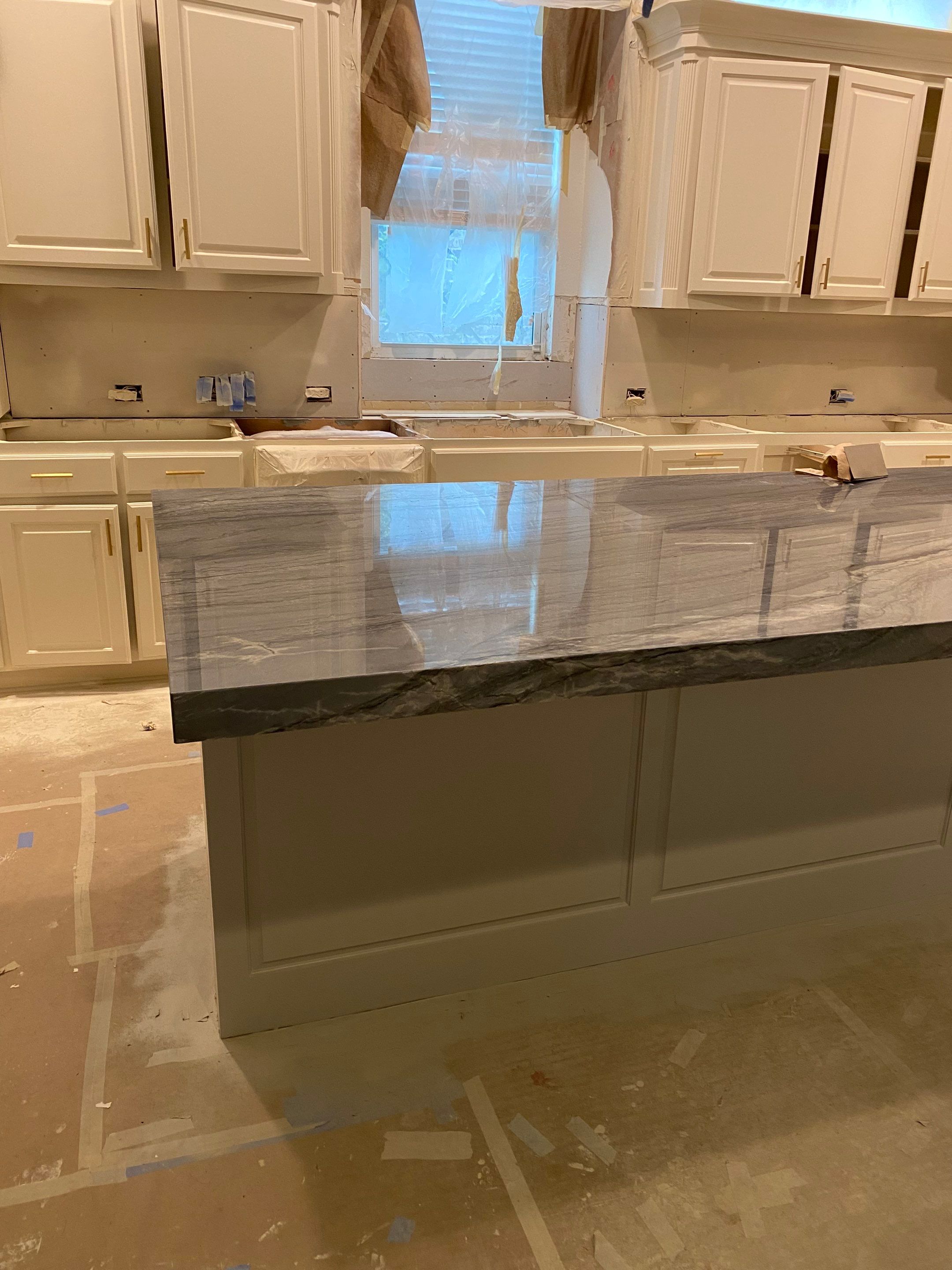 Kitchen Remodel using Quartzite by SLM General Contractors & Roofing
