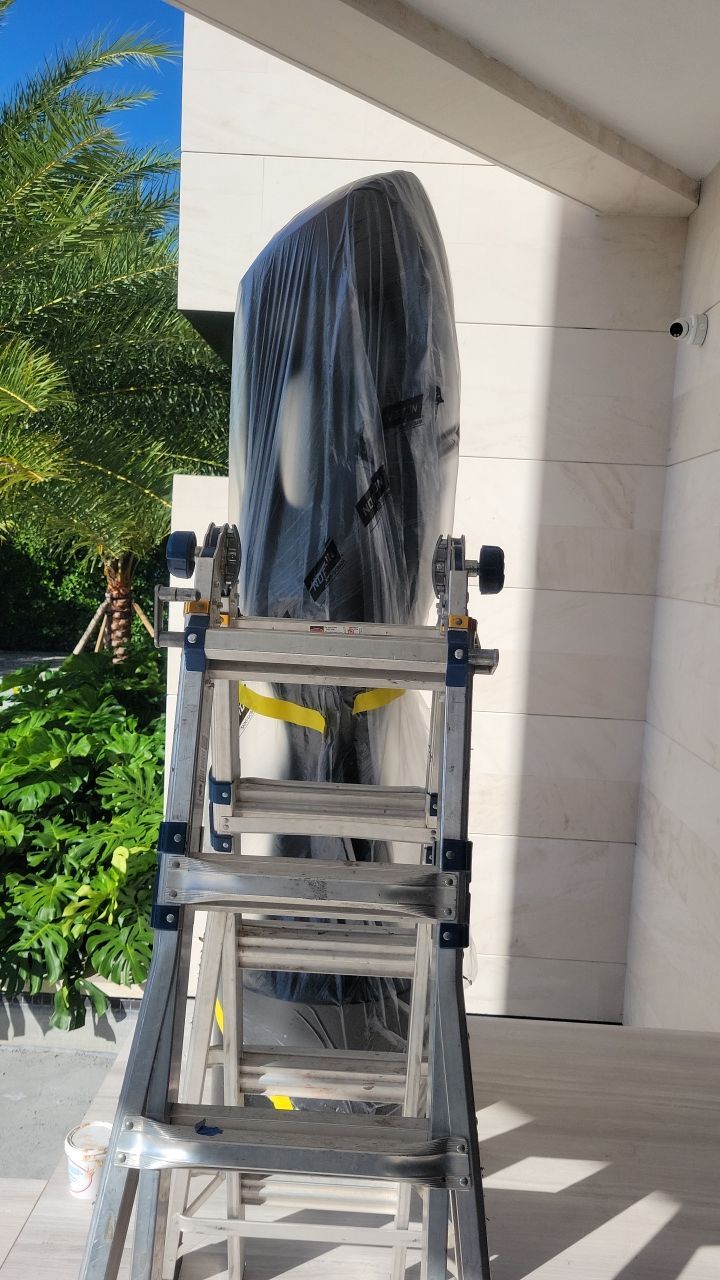 Custom Material Pivot Door installation by Impact Precious Wood Inc.