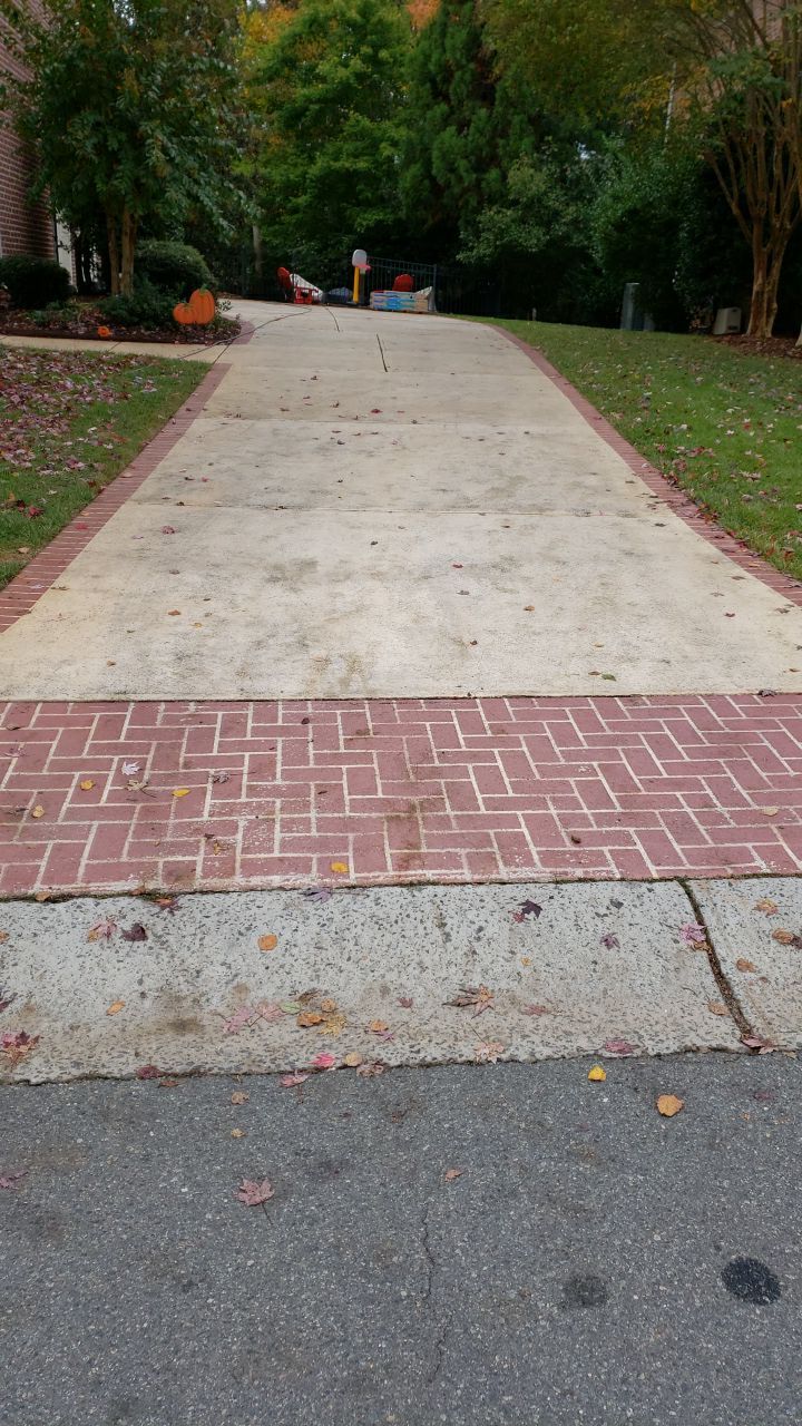 Driveway Clean using cleaner by Power Wash Masters LLC