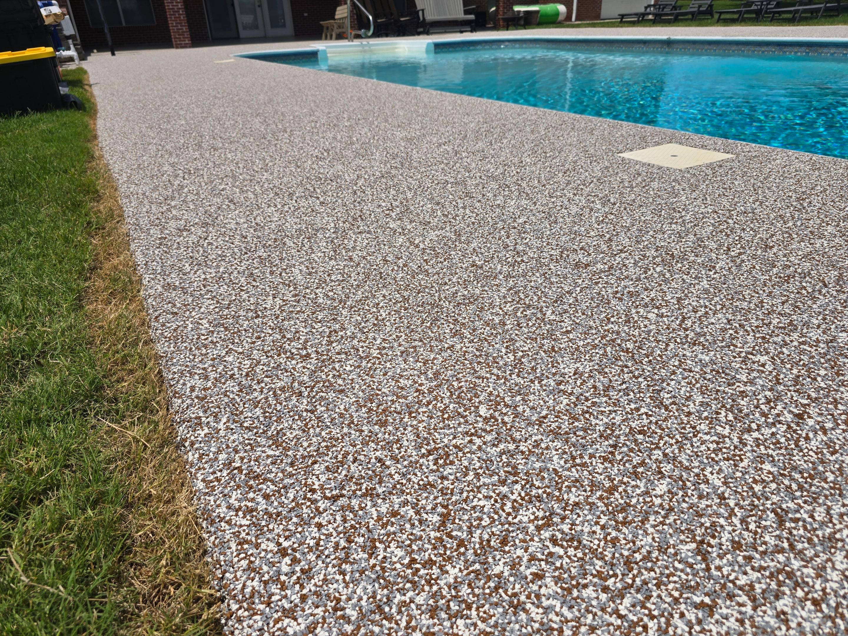 Pool Deck and Porch Using Brownstone and Coldwater Canyon by Elite Floor Solutions