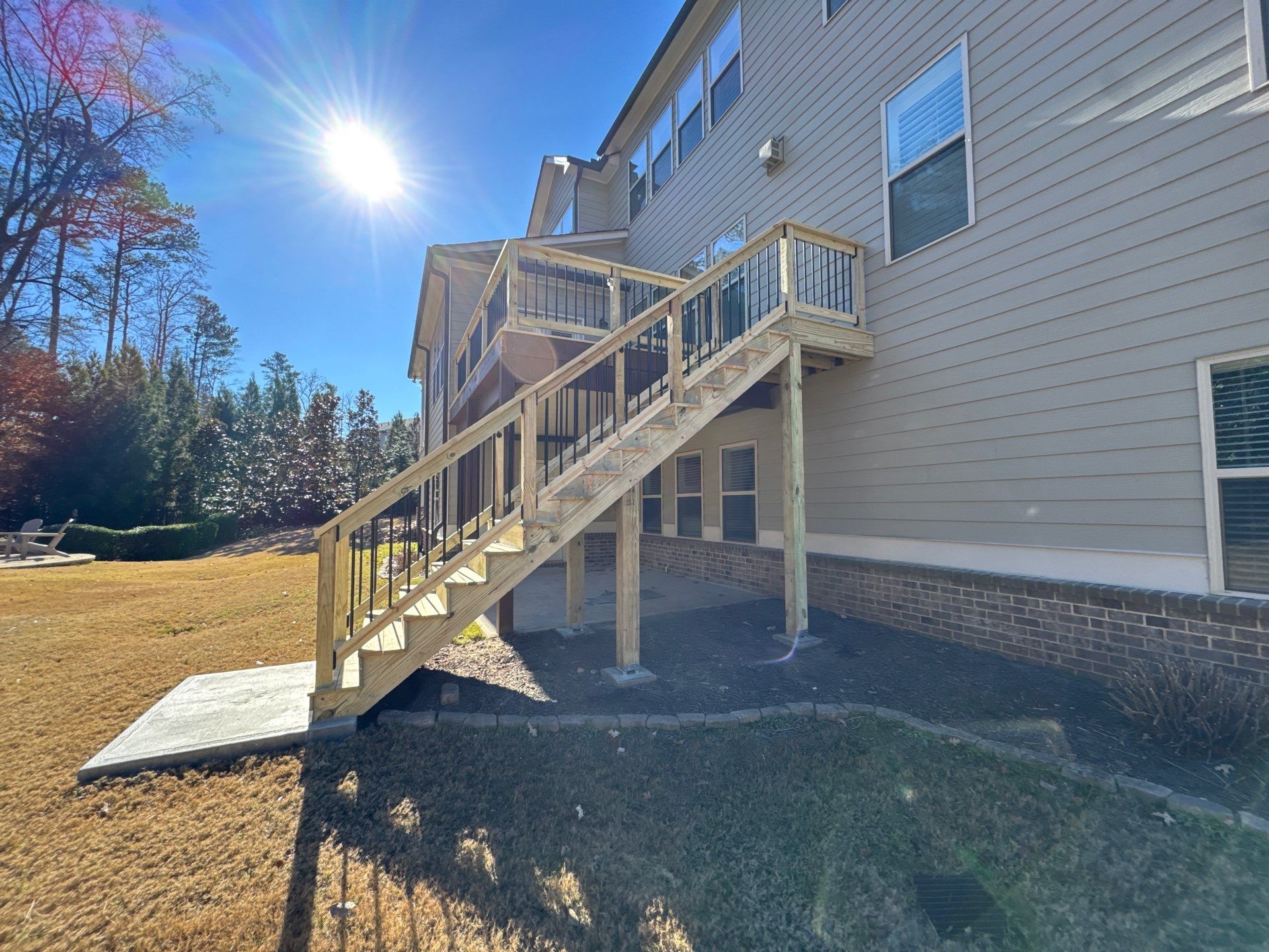 Custom Pressure-Treated Deck with Metal Balusters in Marietta by Swift Home Renovations