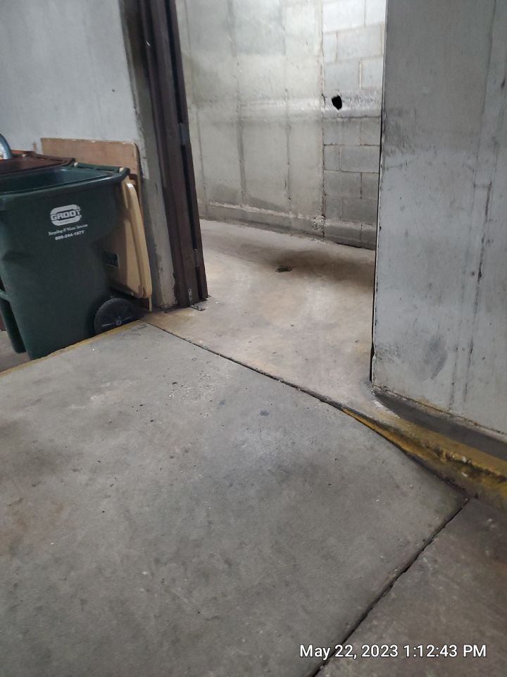 Parking garage using Hot water by Northern Power Washing LLC.