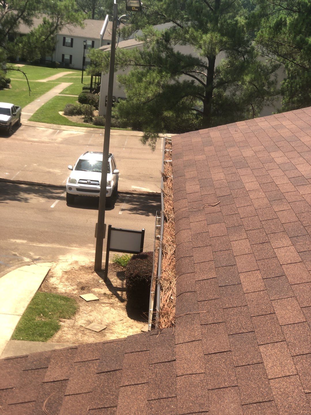 Commercial gutter cleaning Mississippi before photo with filled gutters