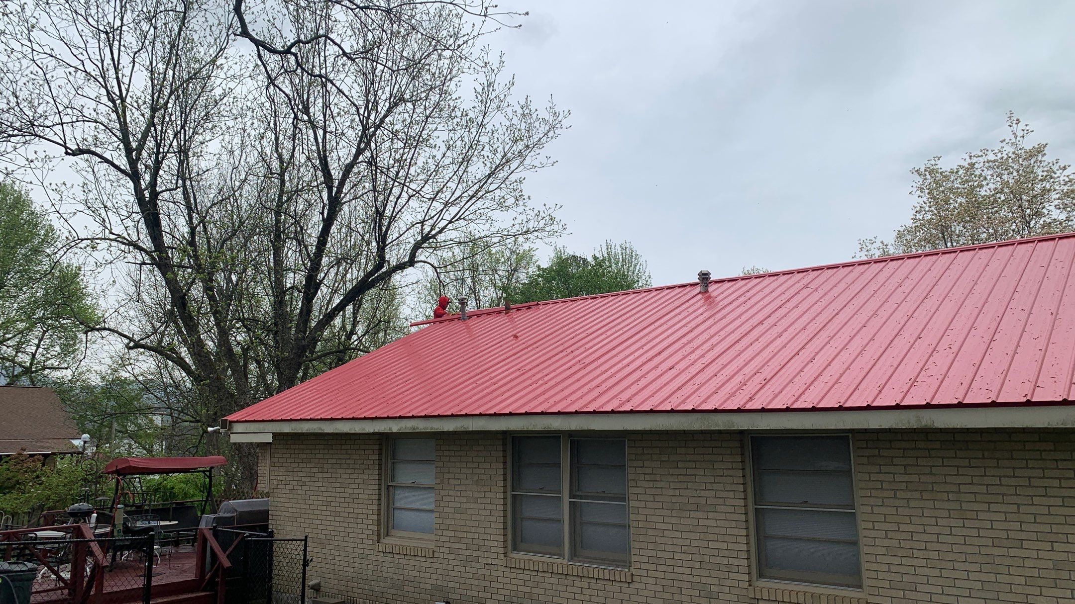 Residential Roofing Installation using 26 Gauge Colored Panels by Hostetler Roofing