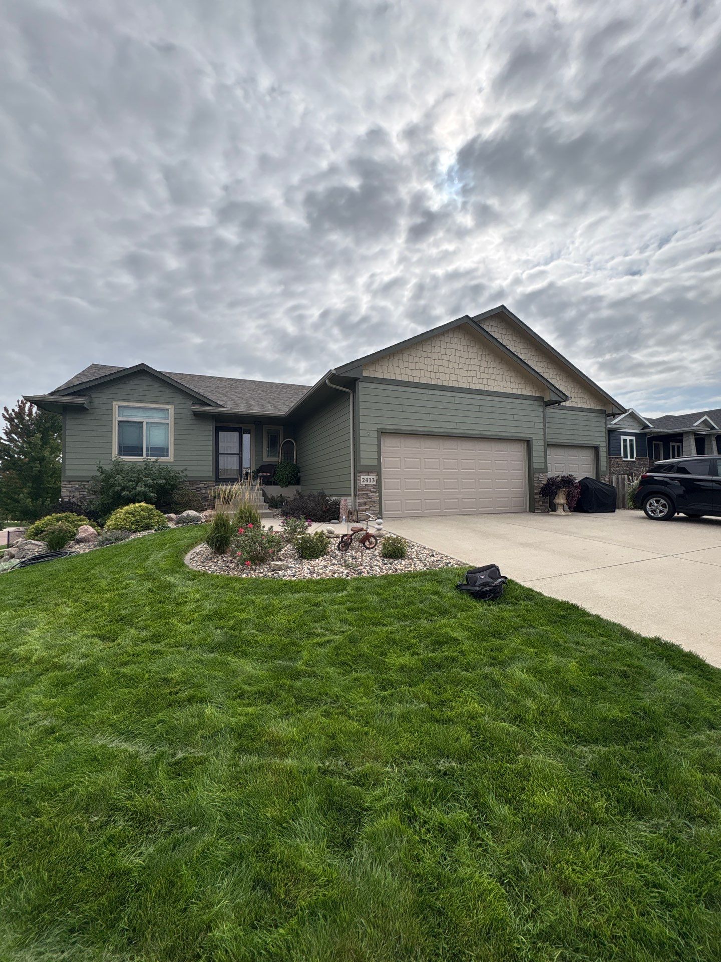 Residential Exterior Painting and Siding Update in Brandon by Select Painting, Coatings & Garage Cabinets