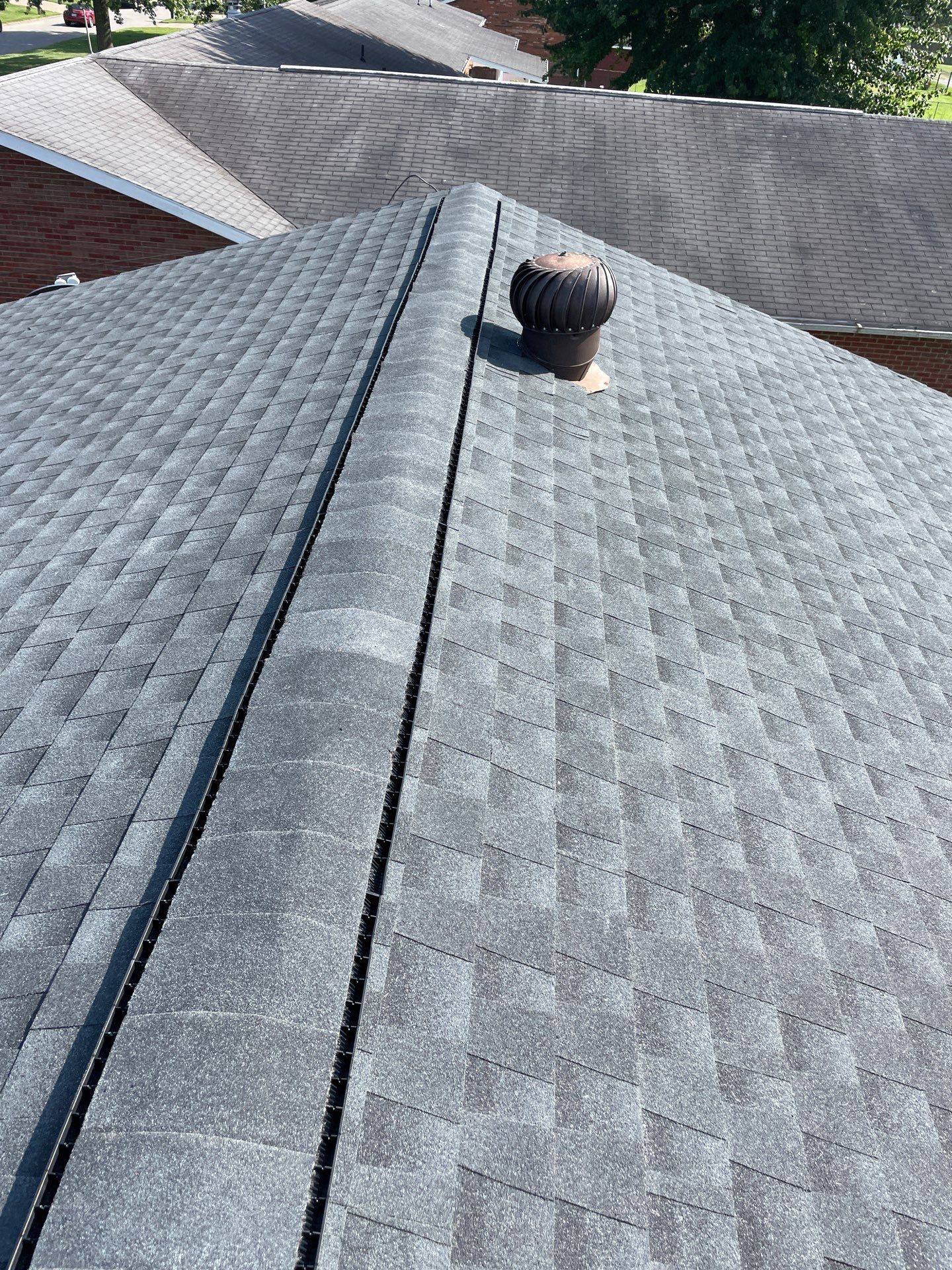 Residential Roofing Installation using GAF Timberline HDZ Charcoal by Rainstoppers Roofing