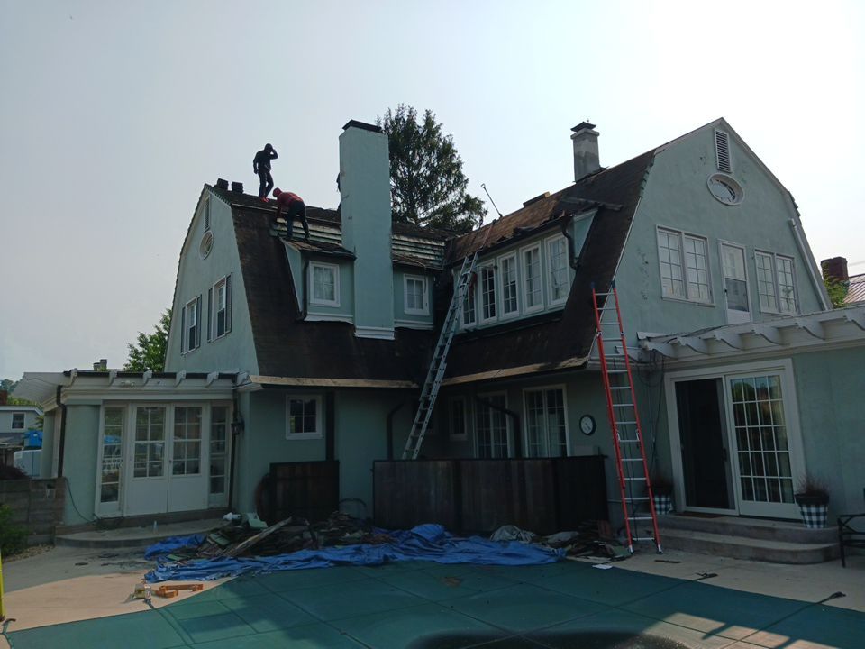 Slate removal/Cedar Shake replacement by Storm Contracting 