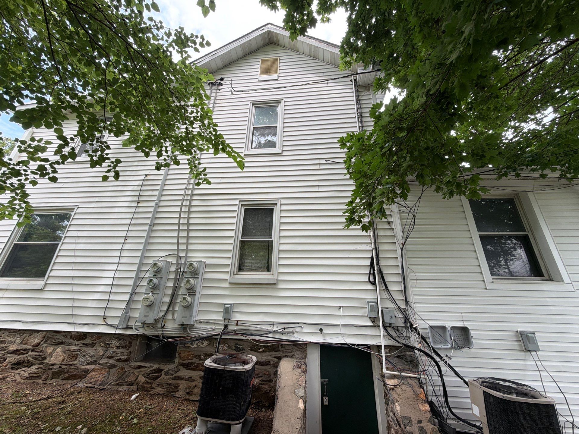 Whole-Property House Washing for Vinyl Siding and Stone Accents in Sykesville by Baltimore Pressure Washers Inc.