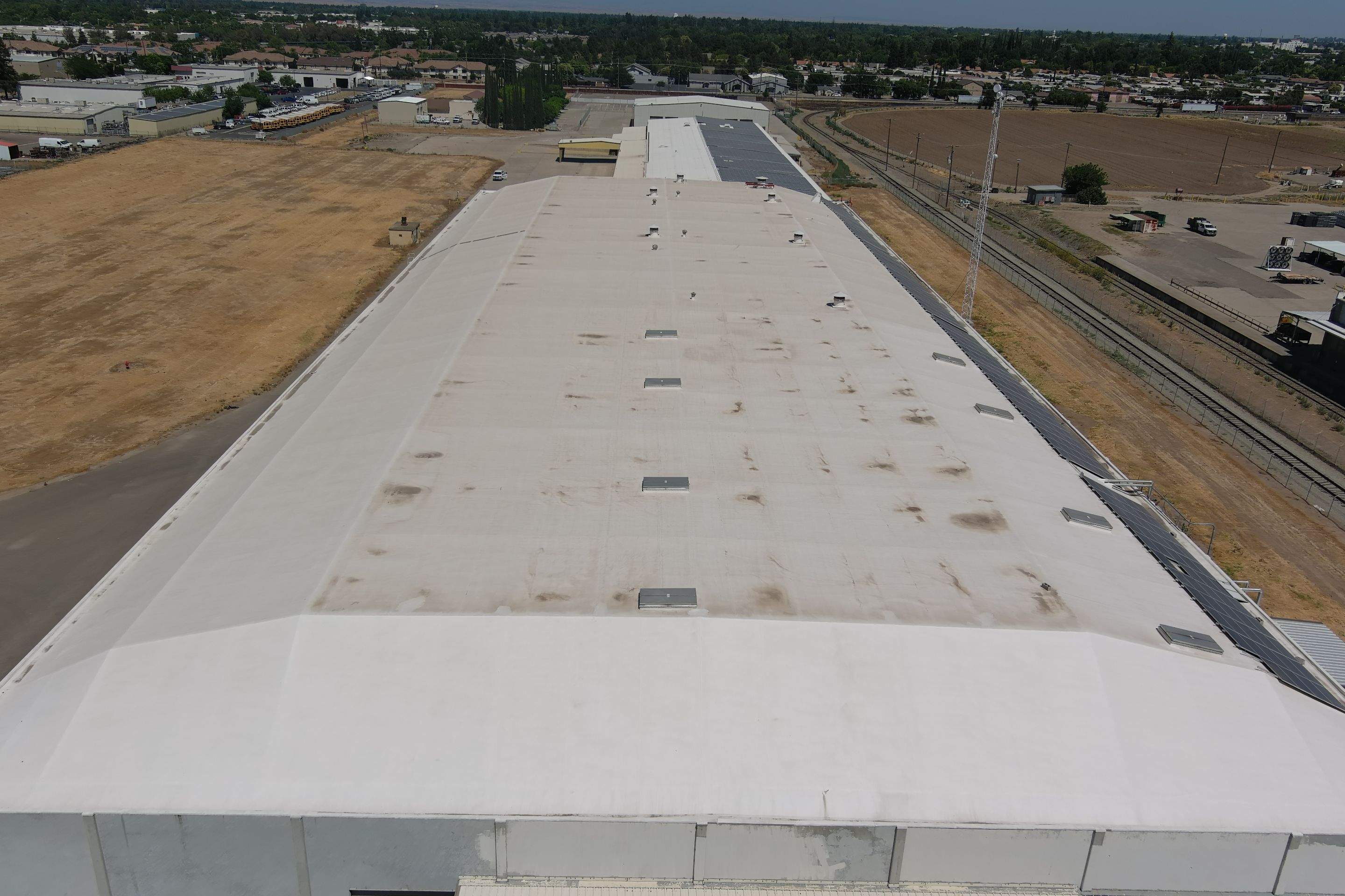 Single-ply restoration system using Conklin Benchmark/PUMA XL fabric and coating by Straight Edge Roofing Inc