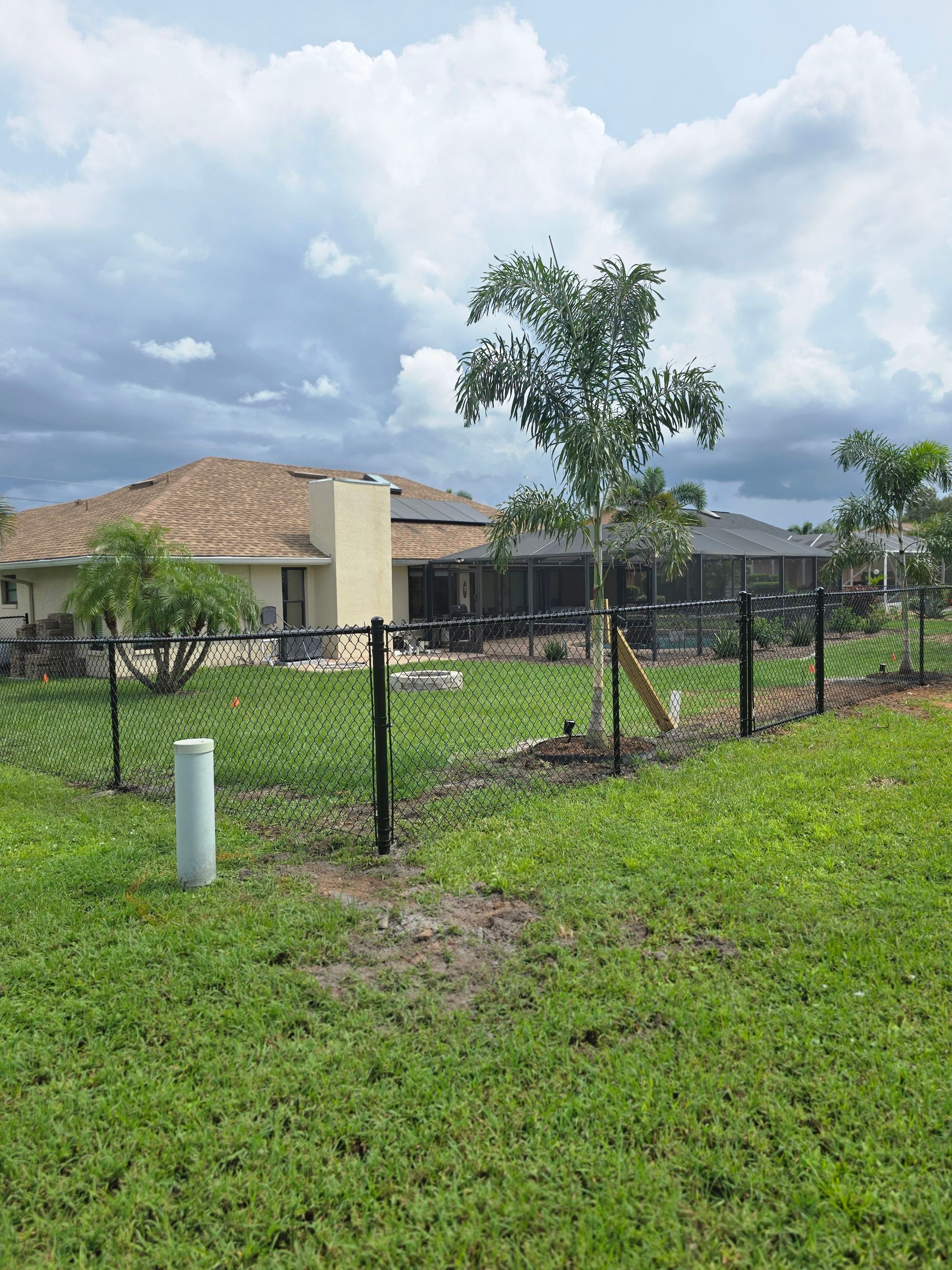 Black Vinyl-Coated Chain Link Fence Installation in Punta Gorda by True Fence LLC