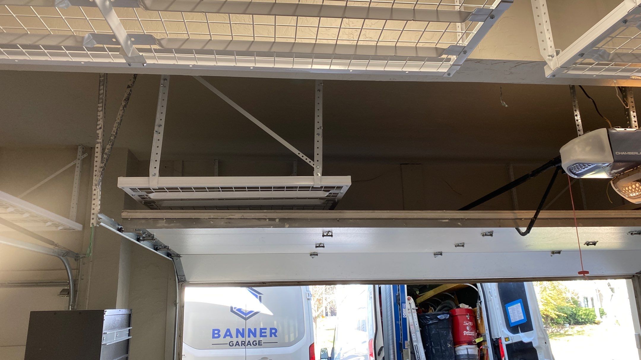 Andrea J. upgrades garage with an overhead ceiling rack!  by Banner Garage