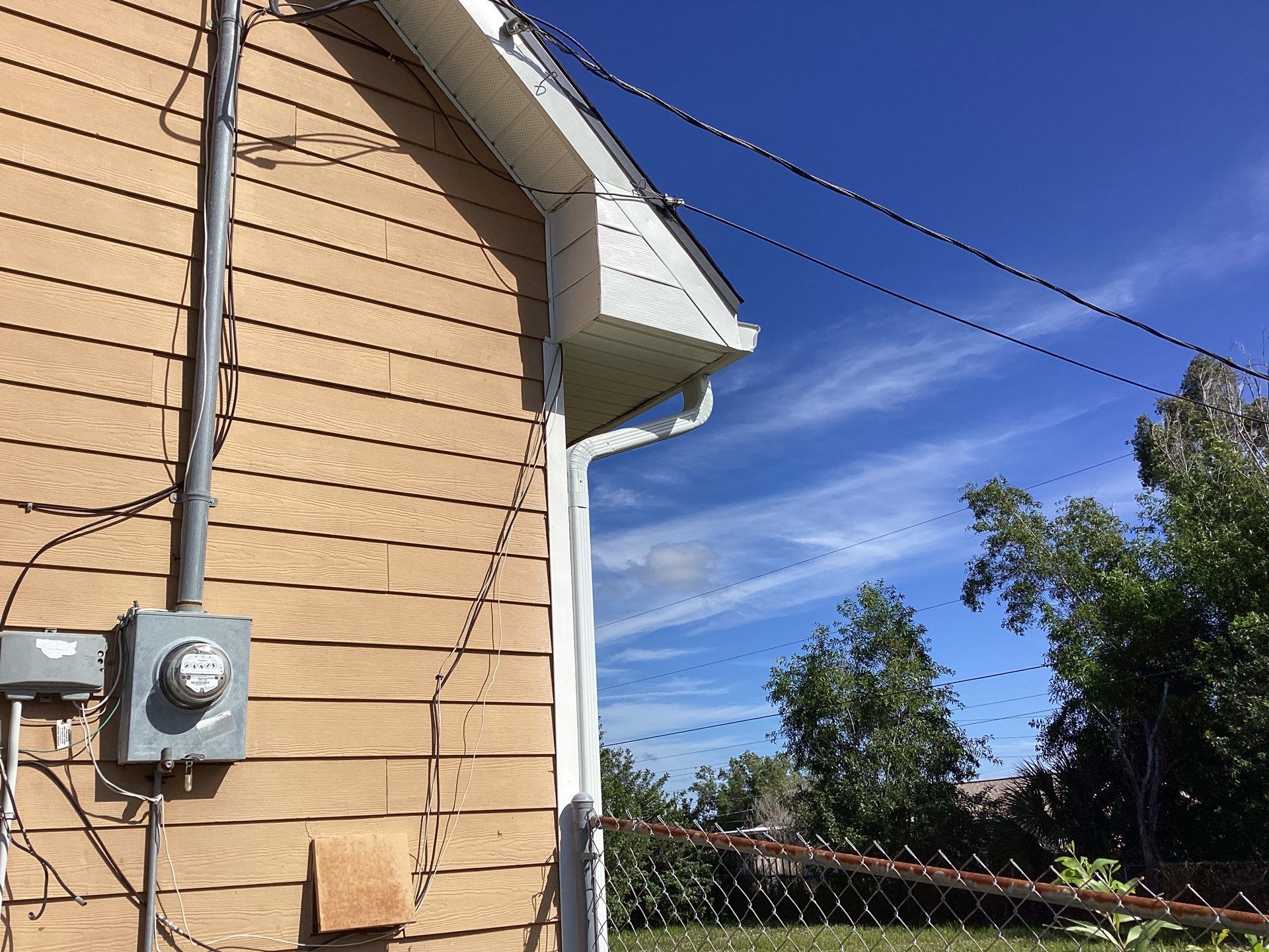 Soffit & Fascia White + New Downspouts by Gutter Professors