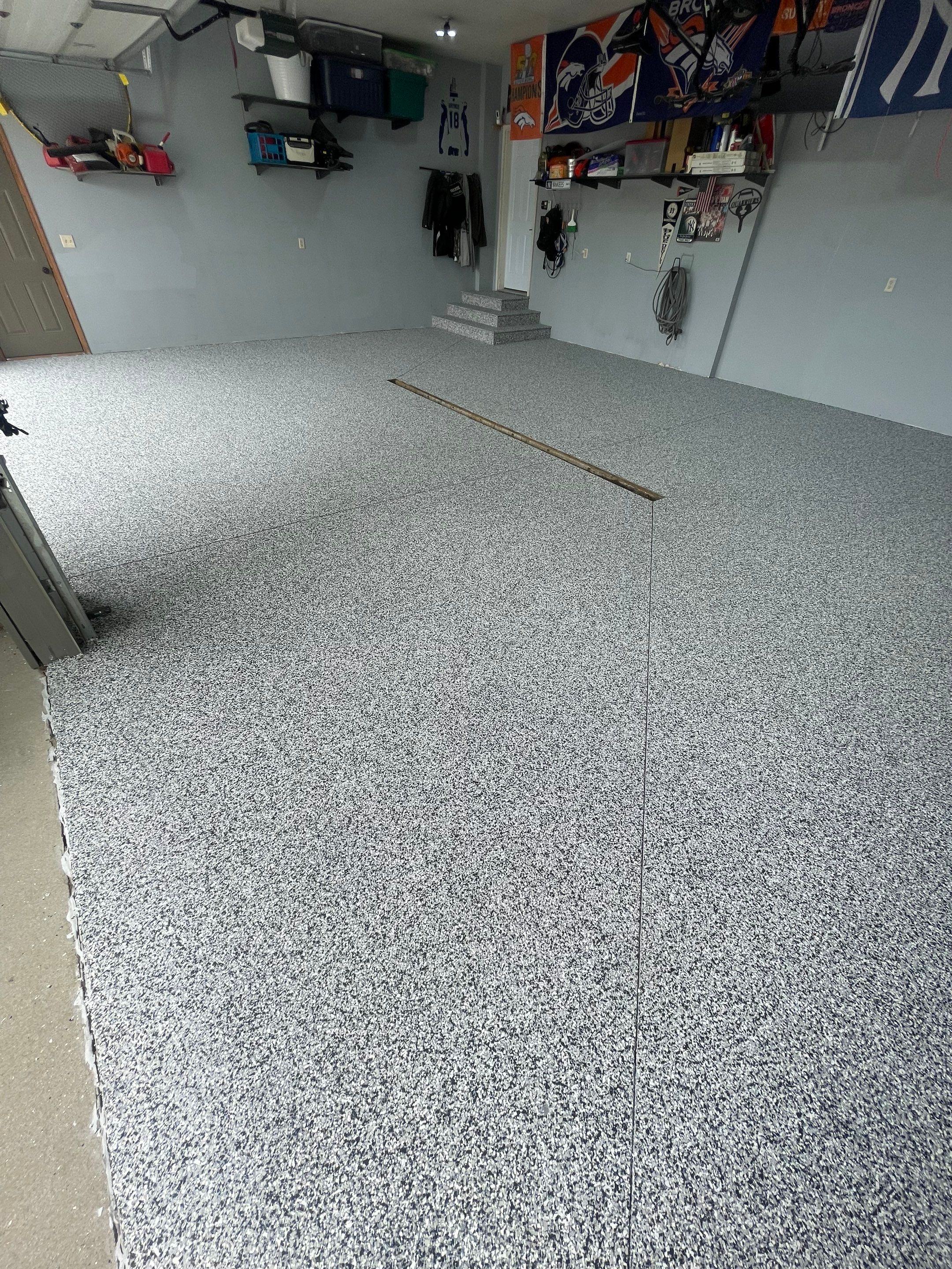 Full Garage Floor Epoxy Coating Installation in Dell Rapids by Select Painting, Coatings & Garage Cabinets