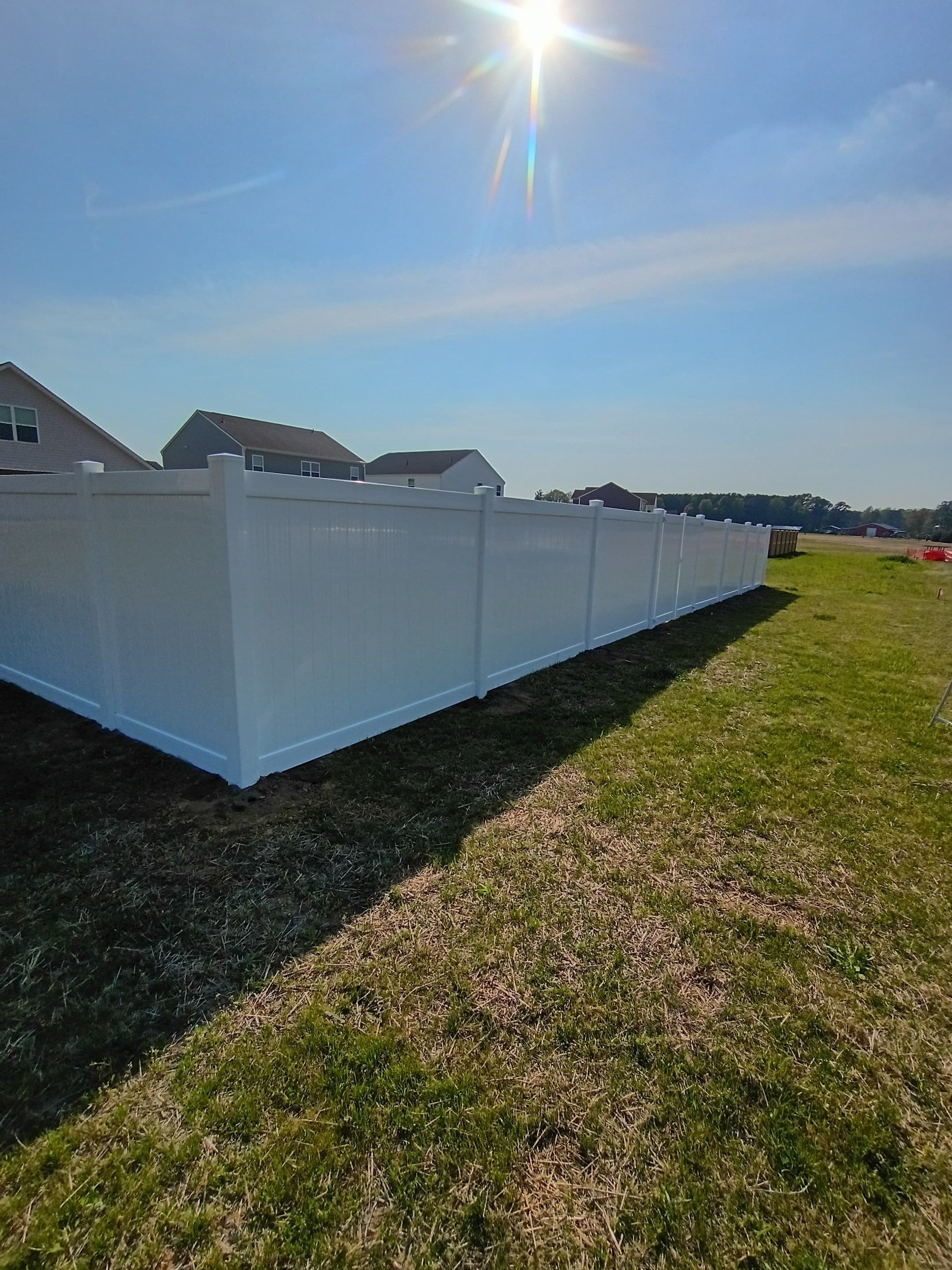 White Vinyl Privacy Fence Installation in Ayden, North Carolina by Superior Fence and Rail