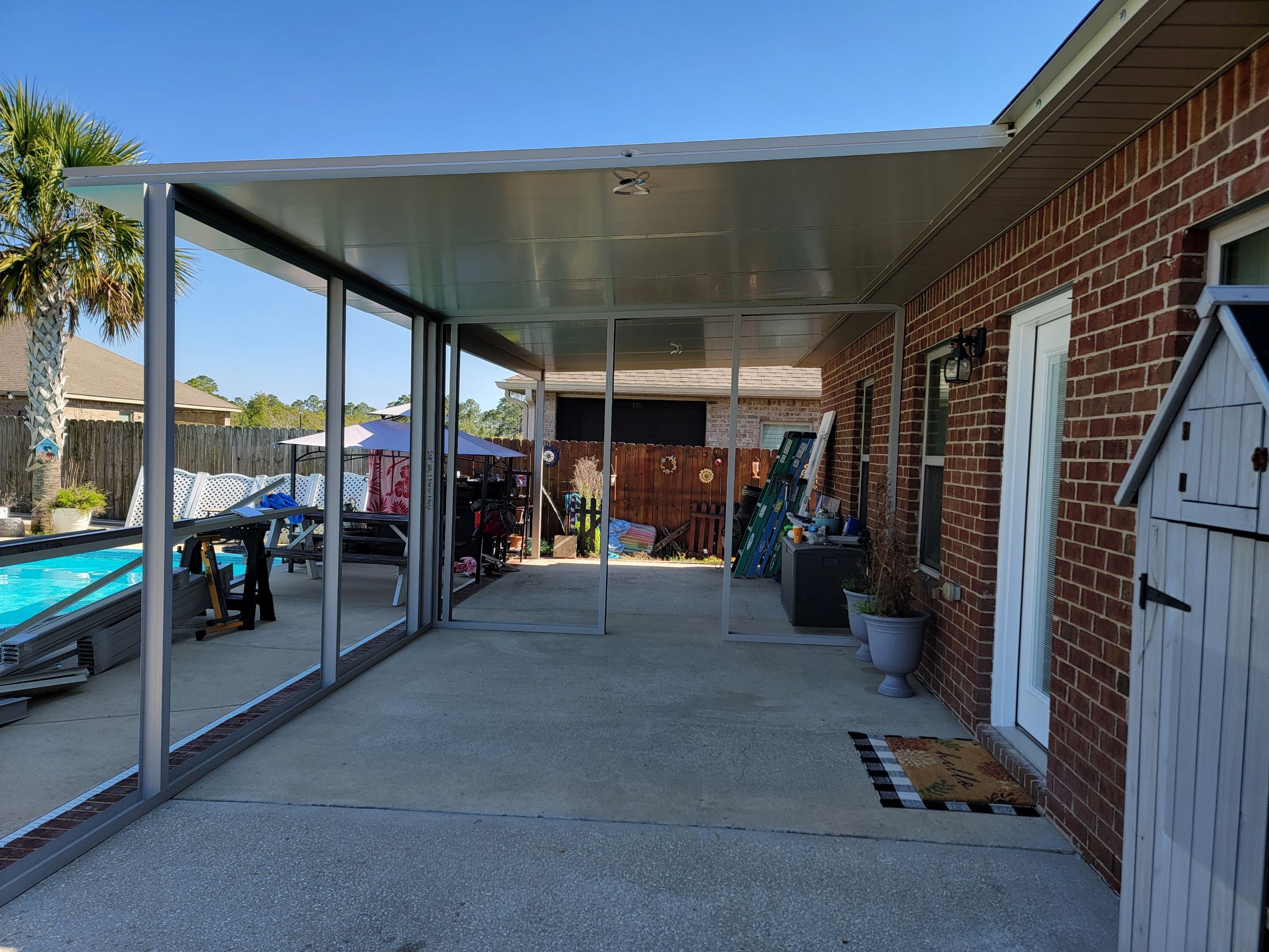 Poolside Screen Room & Patio Cover in Gulf Breeze by Titan Sunrooms