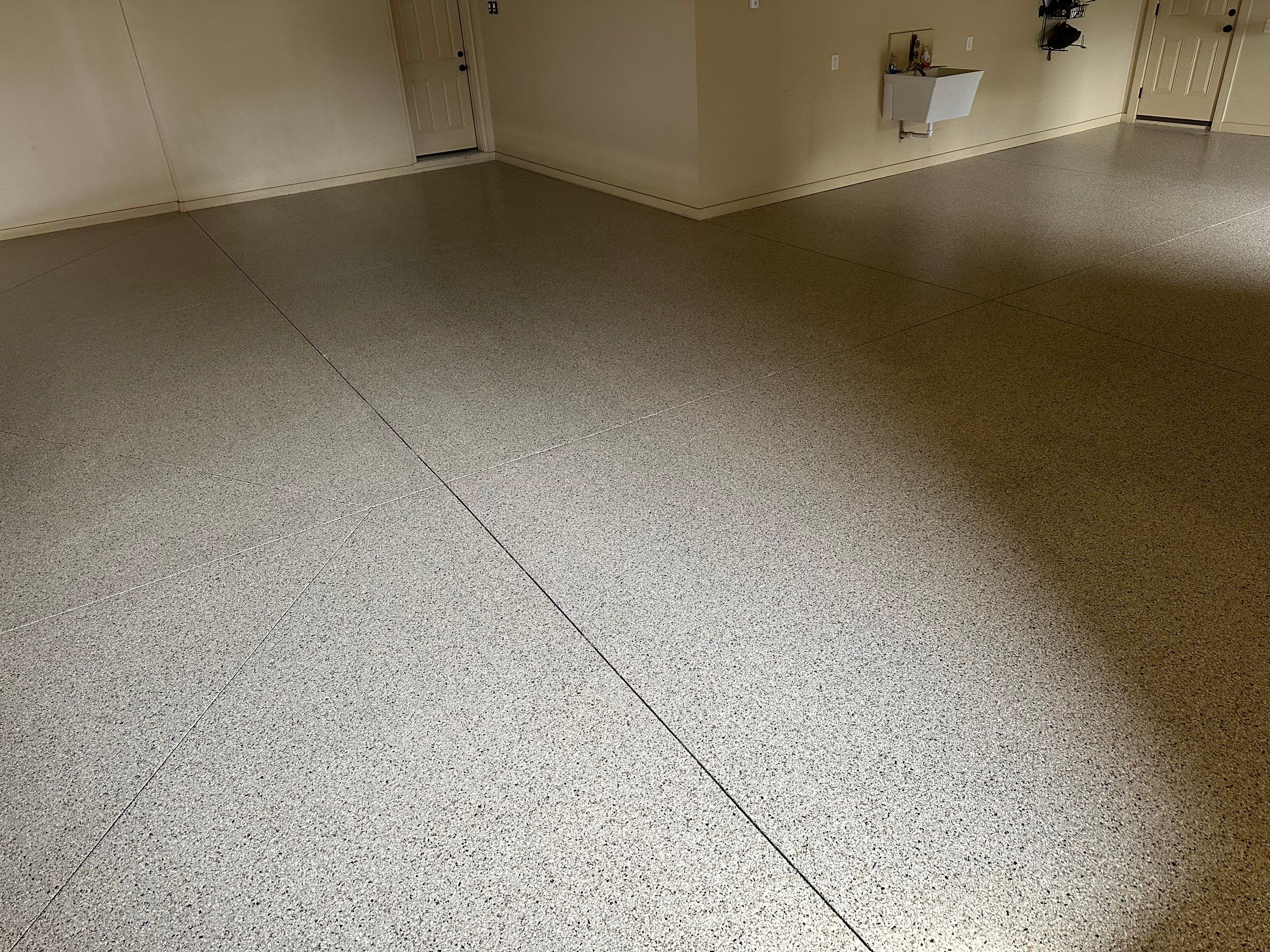 Sioux Falls Garage Floor Concrete Coating with Shoreline Flake Finish by Select Painting, Coatings & Garage Cabinets