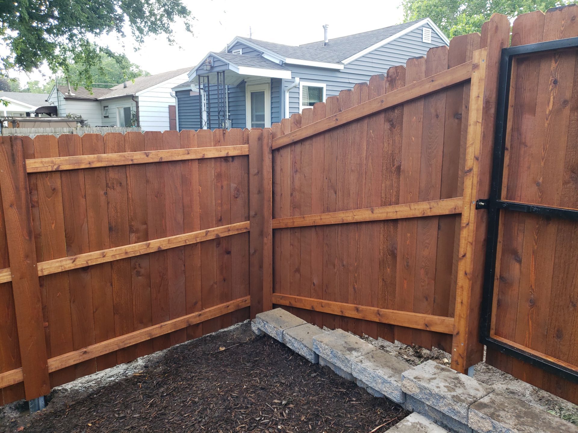 Custom Chestnut Stained Cedar Privacy Fence in Waterloo by Perfect Picket Fence and Stain