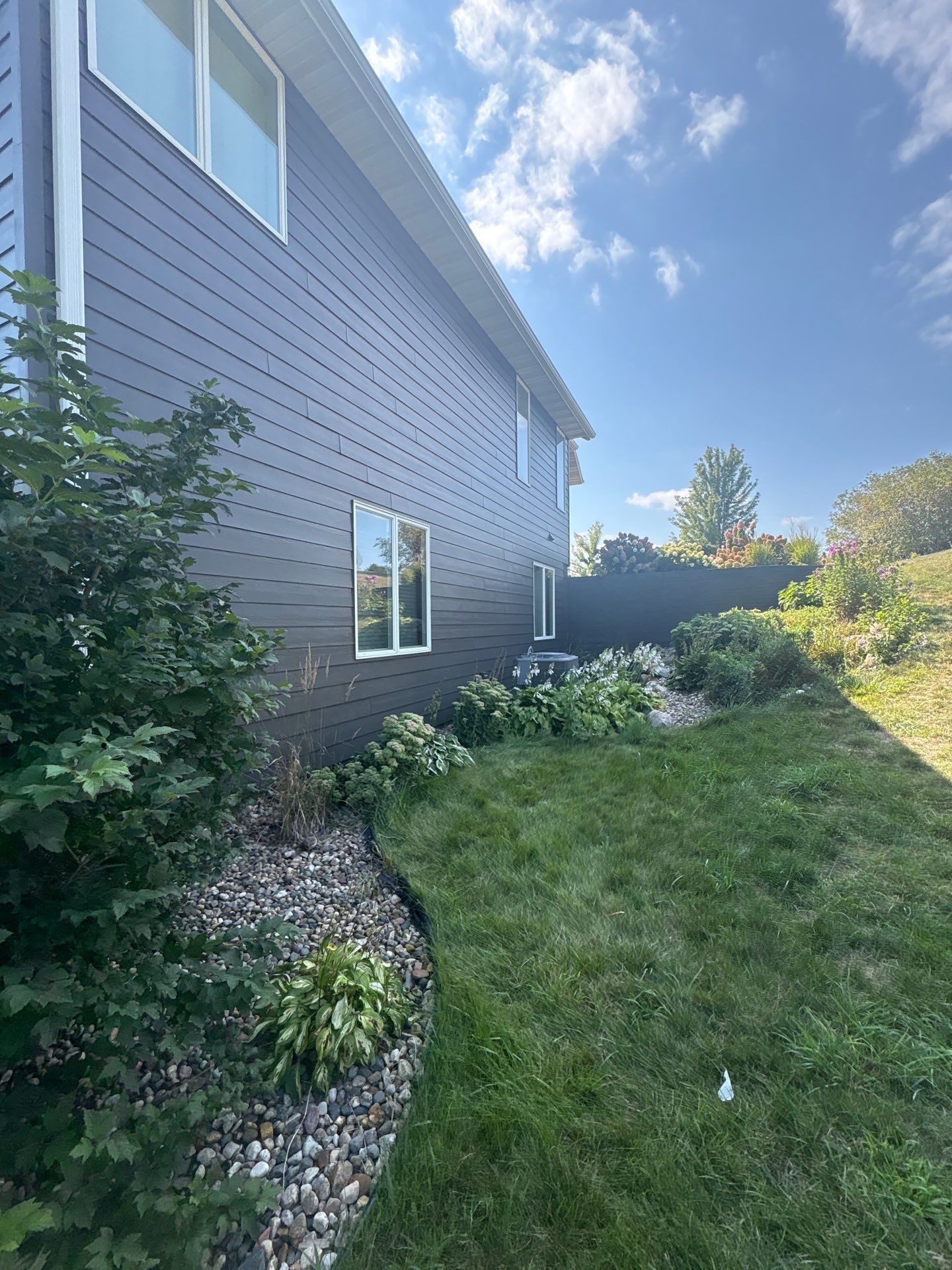 Sioux Falls Residential Exterior Painting and Siding Refresh by Select Painting, Coatings & Garage Cabinets
