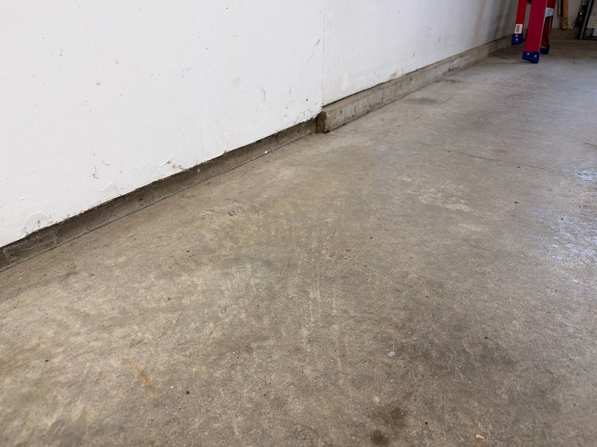 Feather Grey Garage Floor Coating Installation in Sioux Falls by Select Painting, Coatings & Garage Cabinets