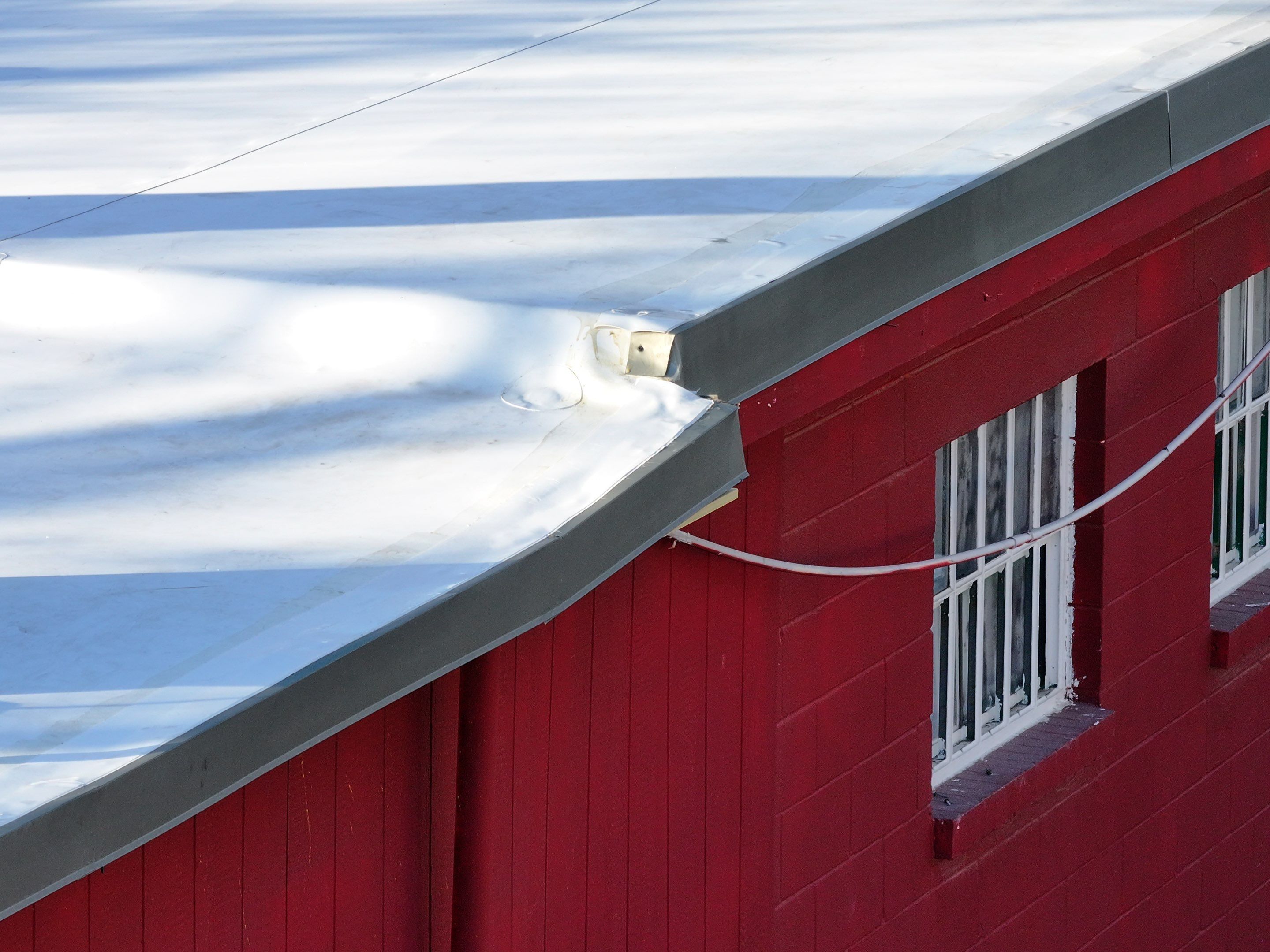Commercial roofing overlay using GAF TPO over an old ballast roof by Becker Roofing and Exteriors