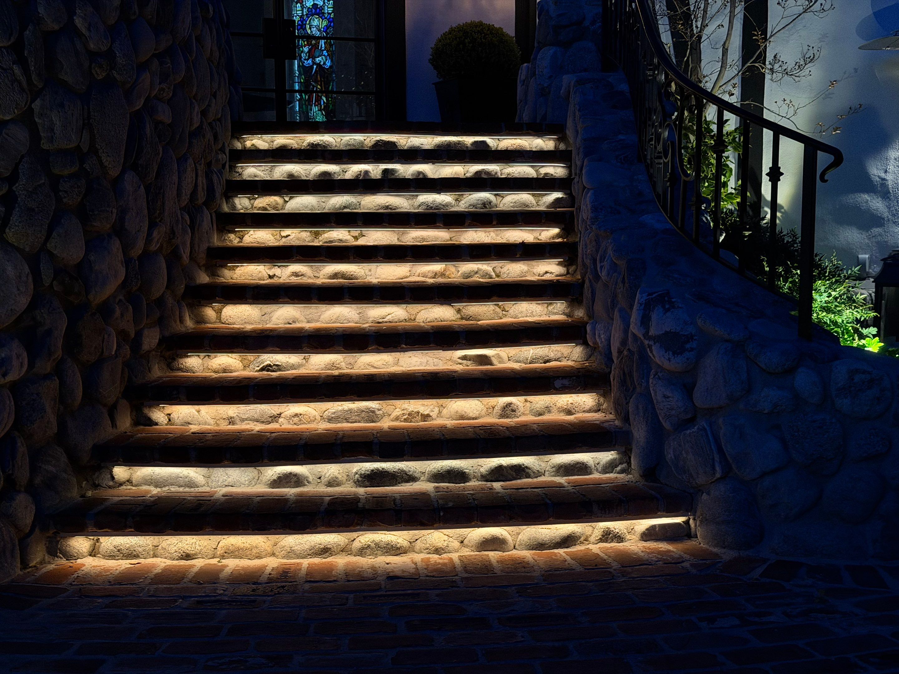 Tudor Estate Landscape Lighting with Integrated Stone Step Illumination by Outdoor Lights + Shades