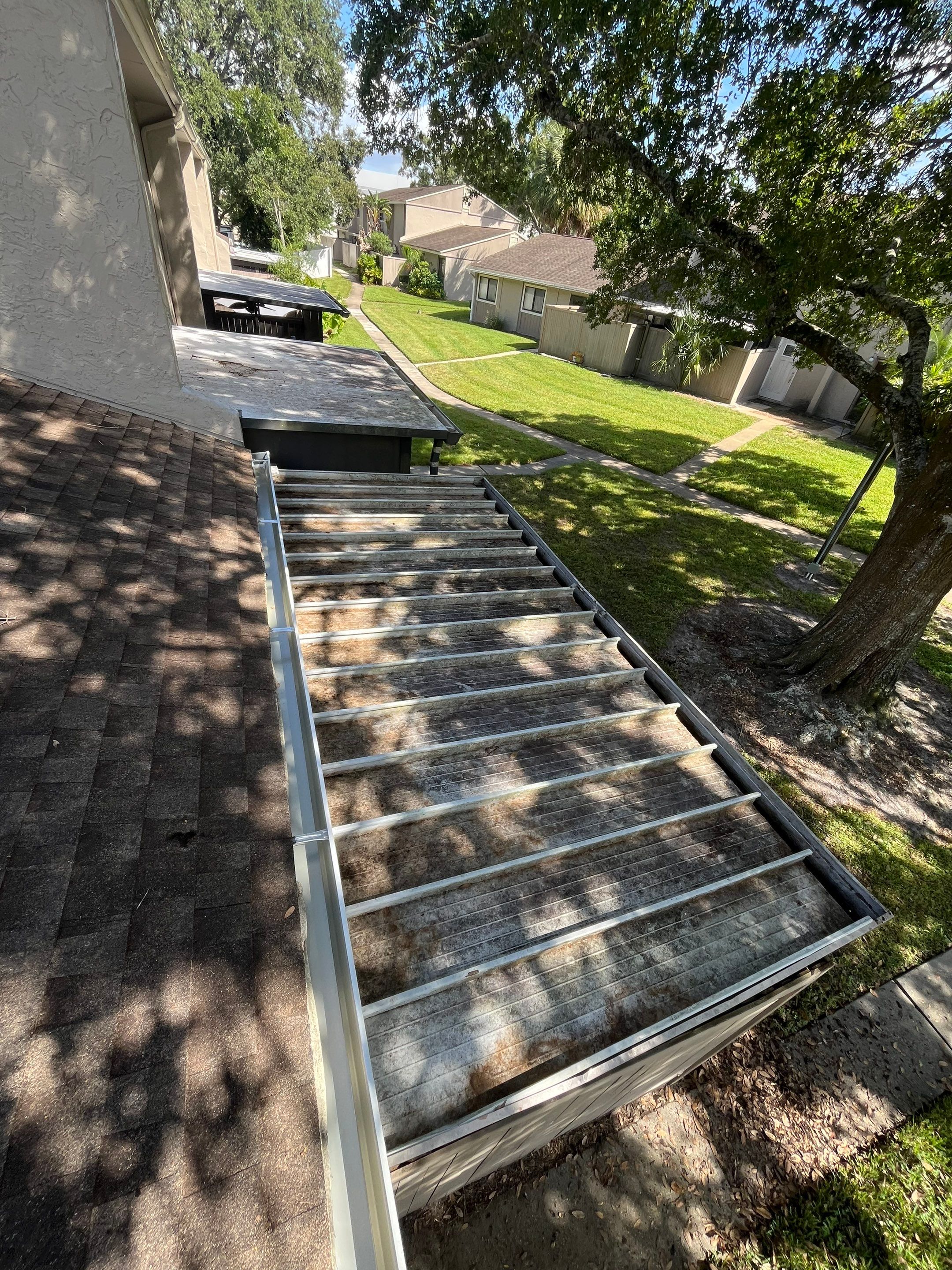 Professional Downspout Installation in Tampa, FL by Gutter Professor by Gutter Professors