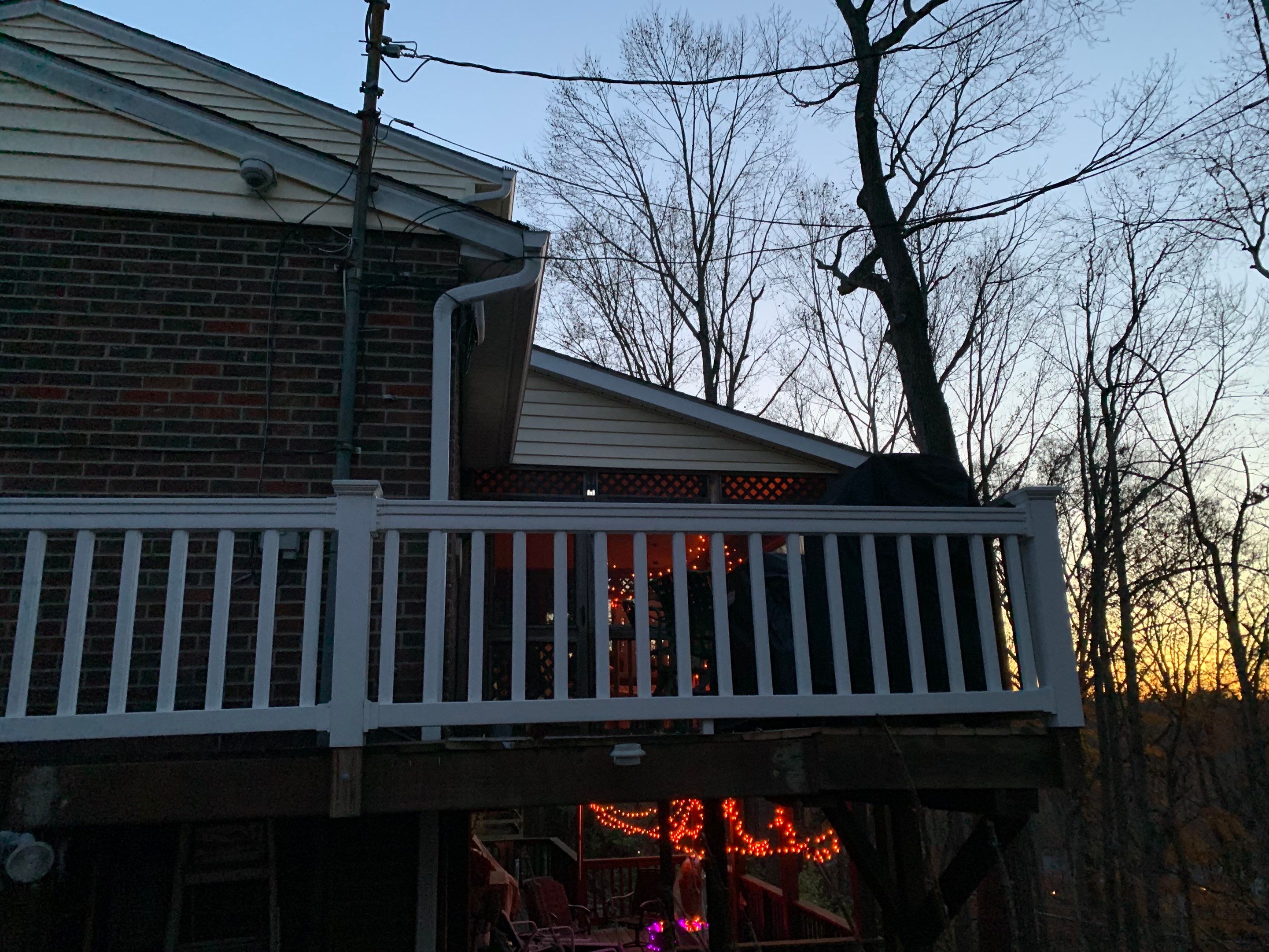 Replace dated vinyl siding with new white exterior Portfolio vinyl siding  by Secure Construction Company Inc