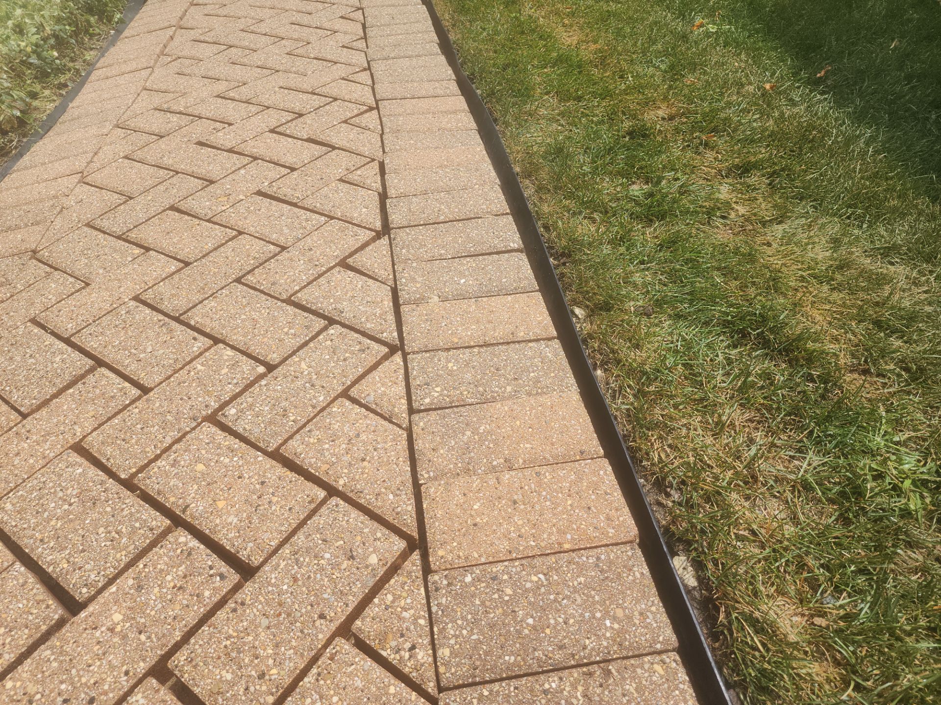 Arlington Heights Brick paver repair, cleaning and sealing by Northern Power Washing LLC.