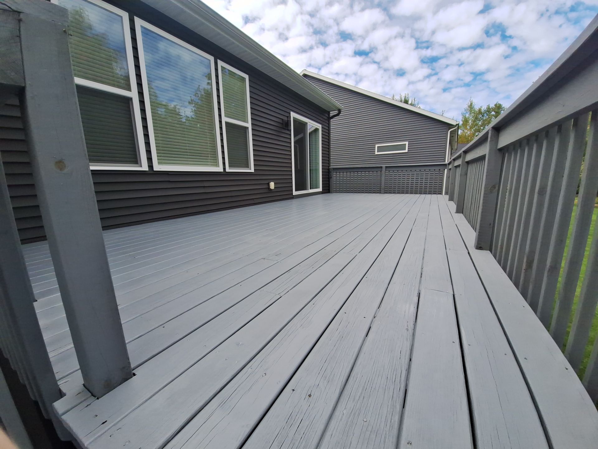 Solid Color Deck Staining for a Residential Home in Spring Lake by Gordon Painting