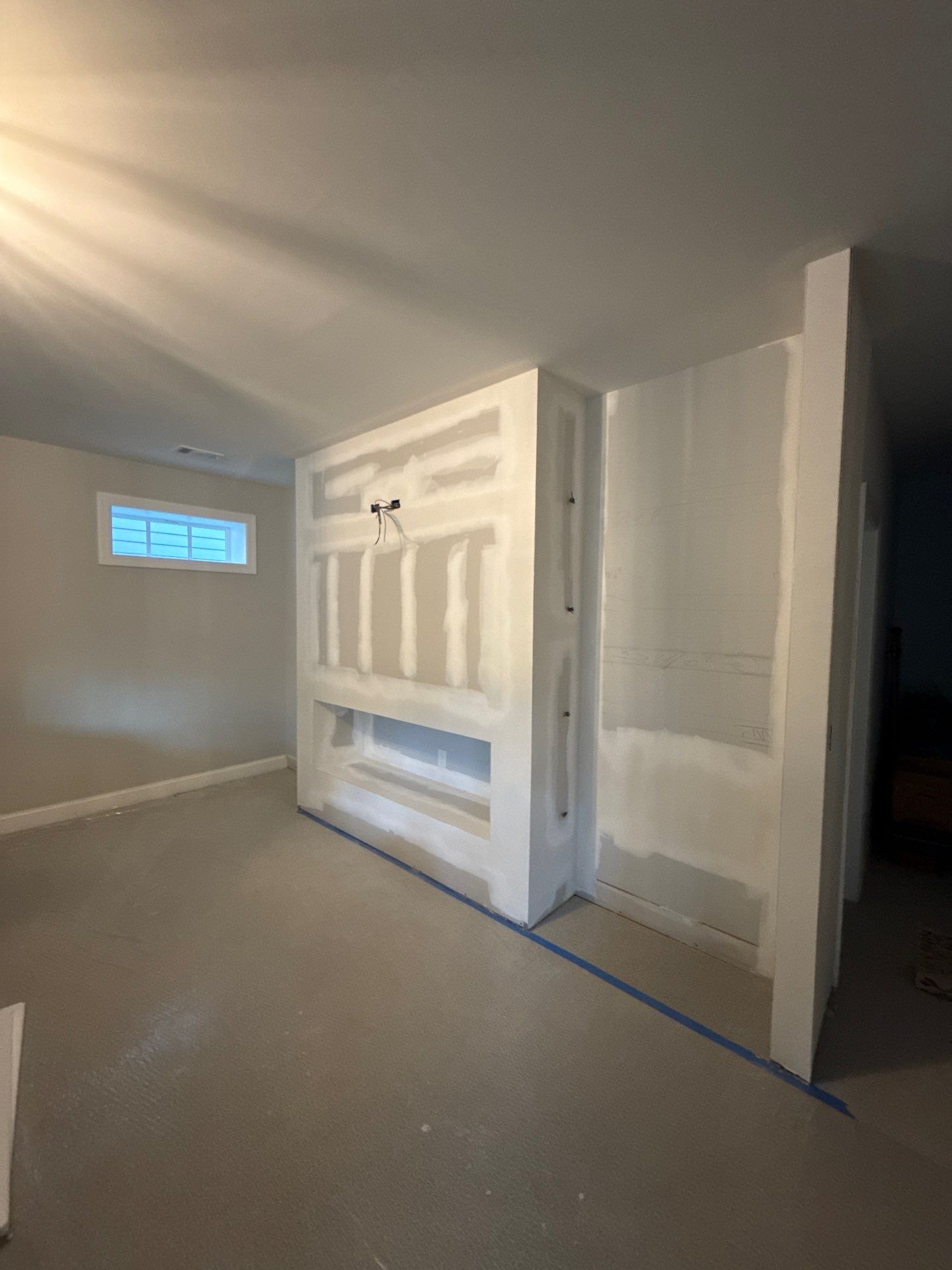 Custom Media Wall and Electric Fireplace Installation in Canton by Swift Home Renovations