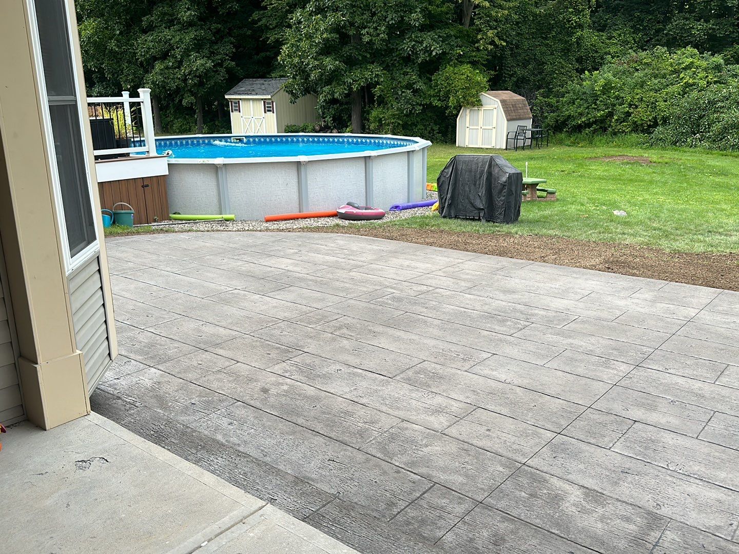 Wood Plank Stamped Concrete Patio  by NG Masonry & Construction LLC