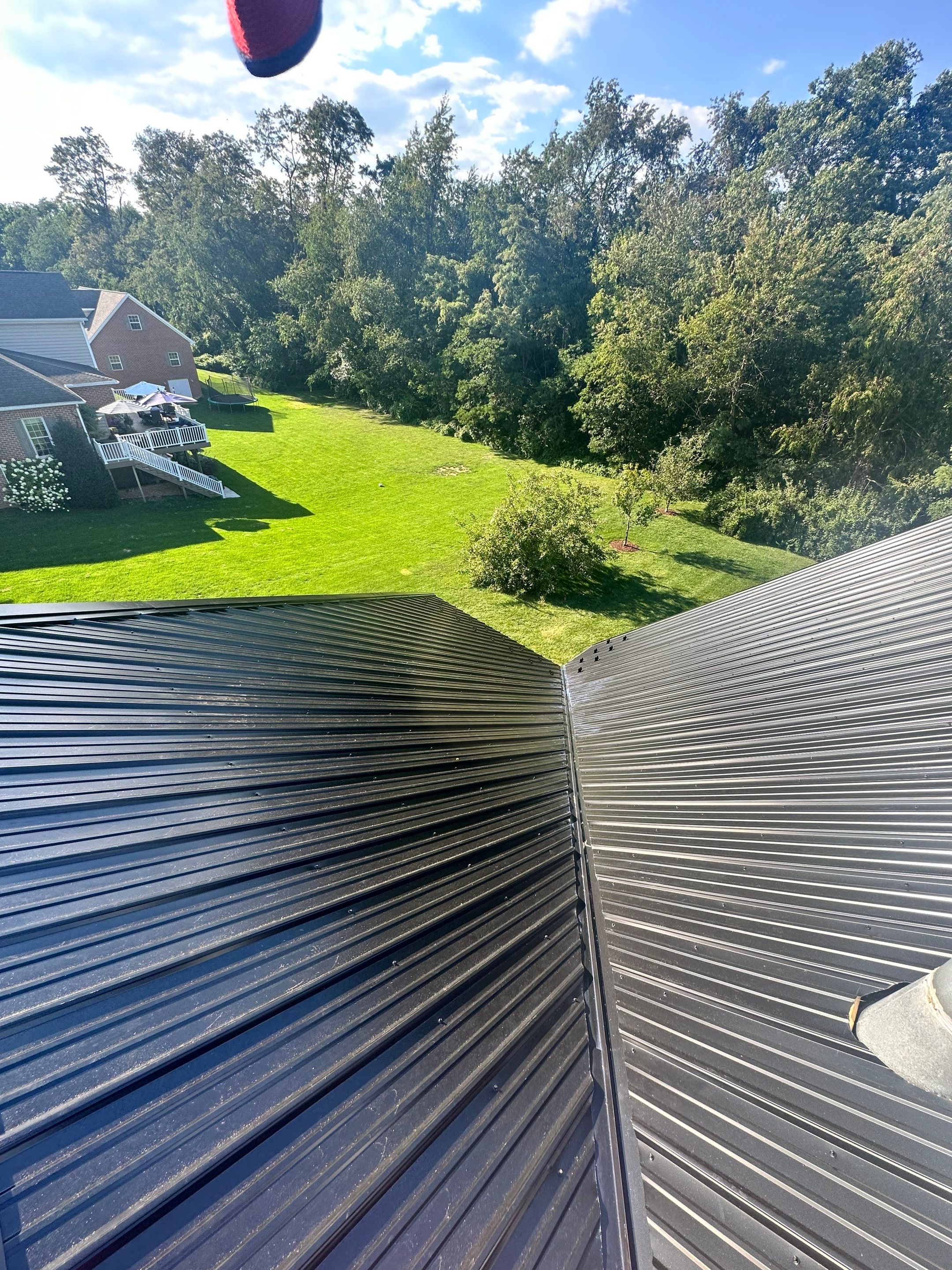 Standing seam / Azm panel in black  by Teflon Roofing