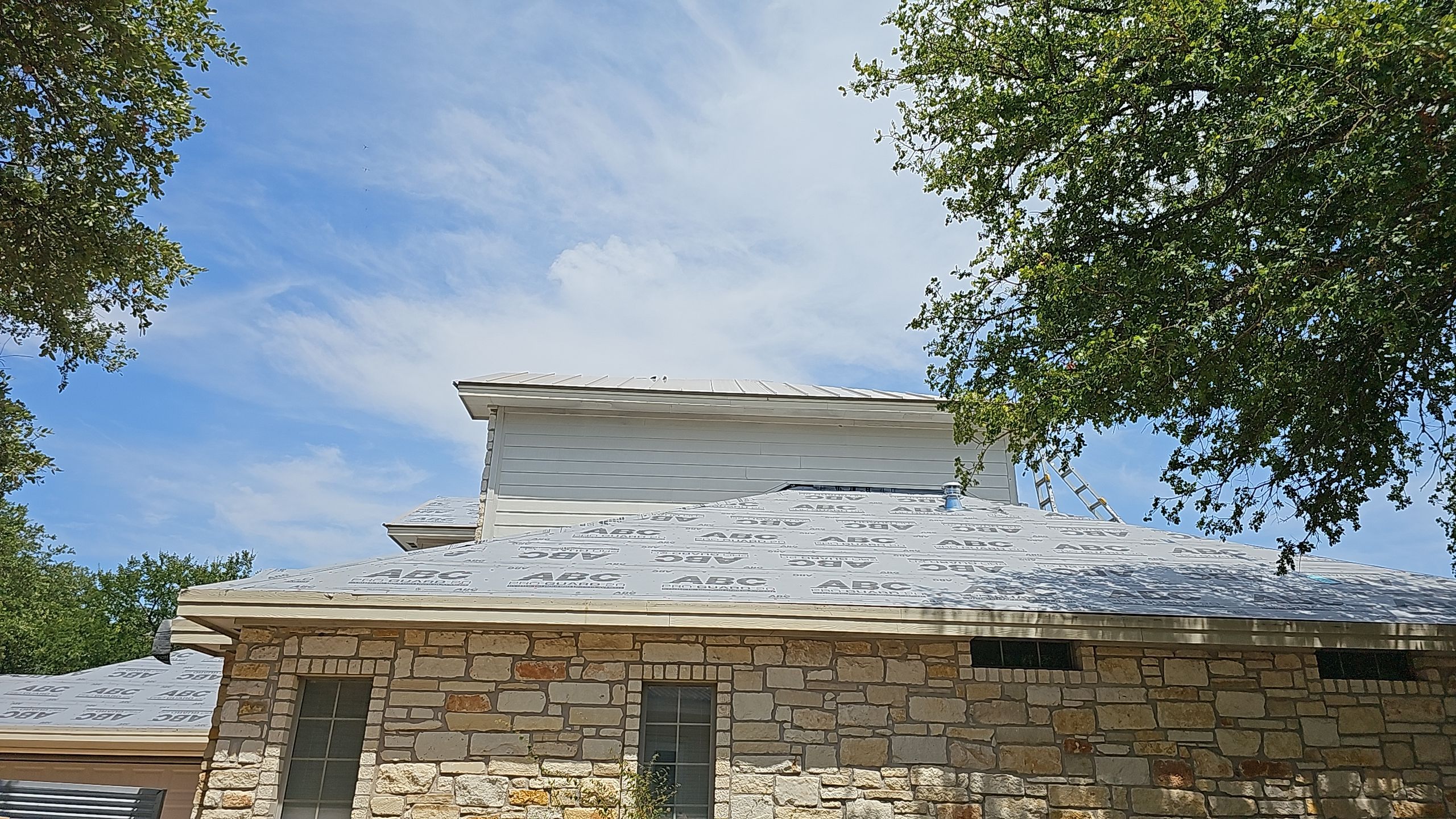 Residential Roof Replacement using 24 GA Double-Lock - Surrey Beige by Action Exteriors Austin
