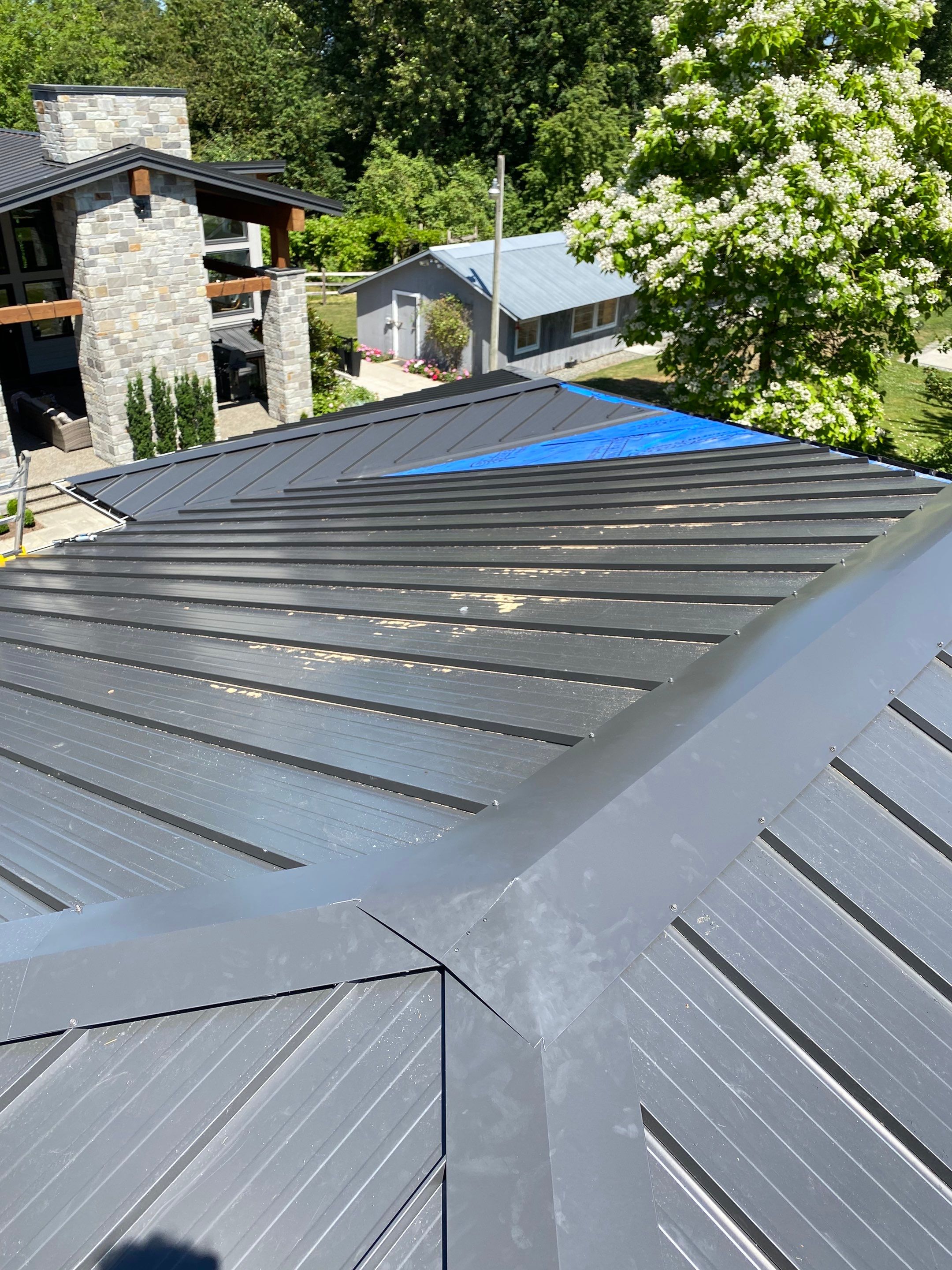 Residential Roofing Installation using 12" Prolok metal  by Top Notch Roofing Inc