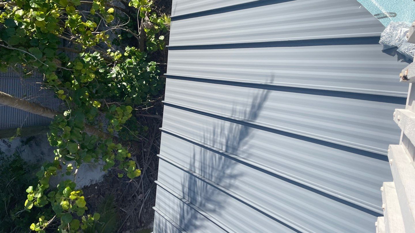 Residential Roofing Installation using Gulf Coast Metals Gulf Seam Panels by Four Peaks Roofing