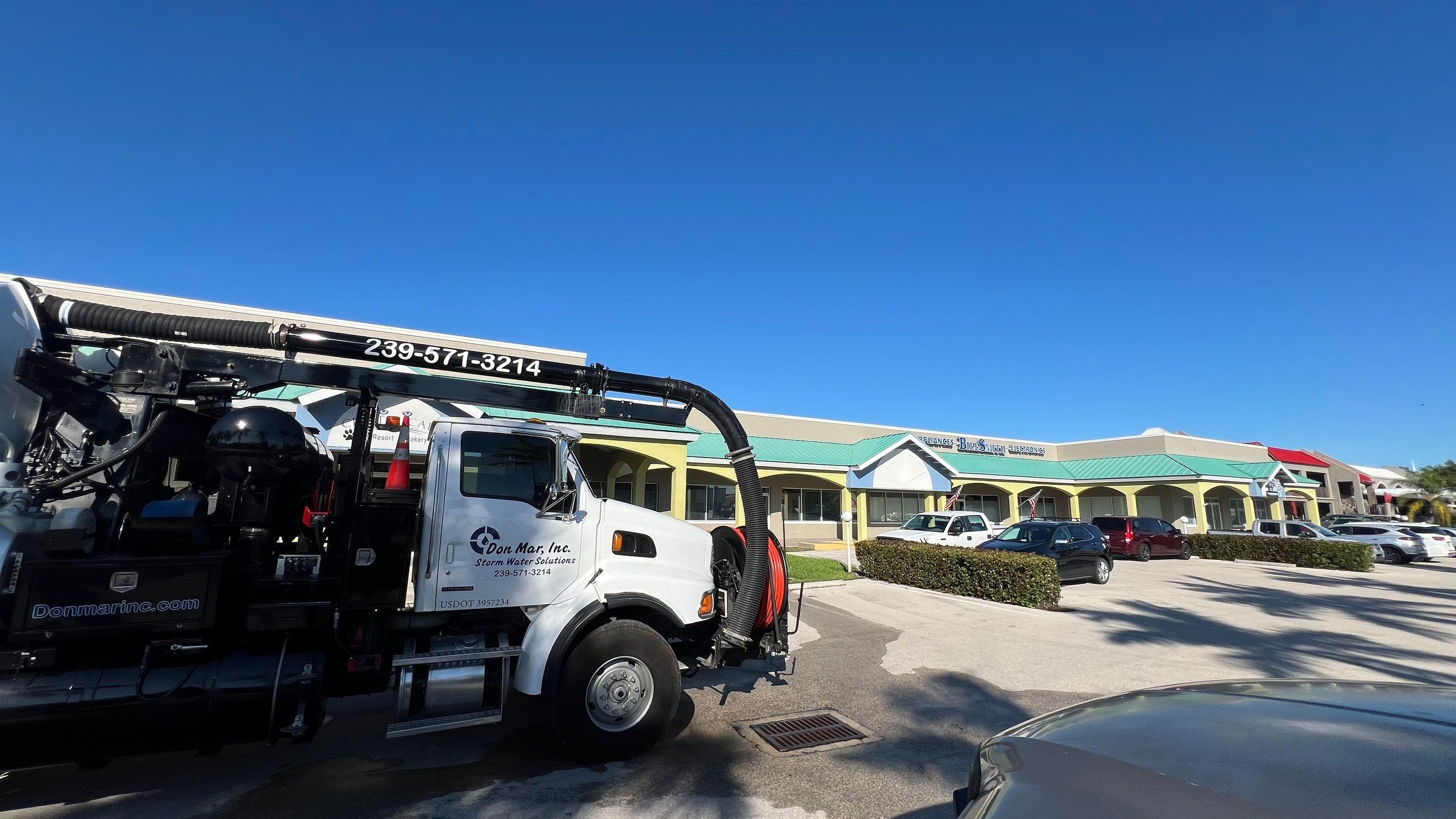 Stromwater System Maintenance at Bill Smith Appliances / Critter Cafe Marco Island Catch Basin by Don Mar, Inc. Storm Water Solutions