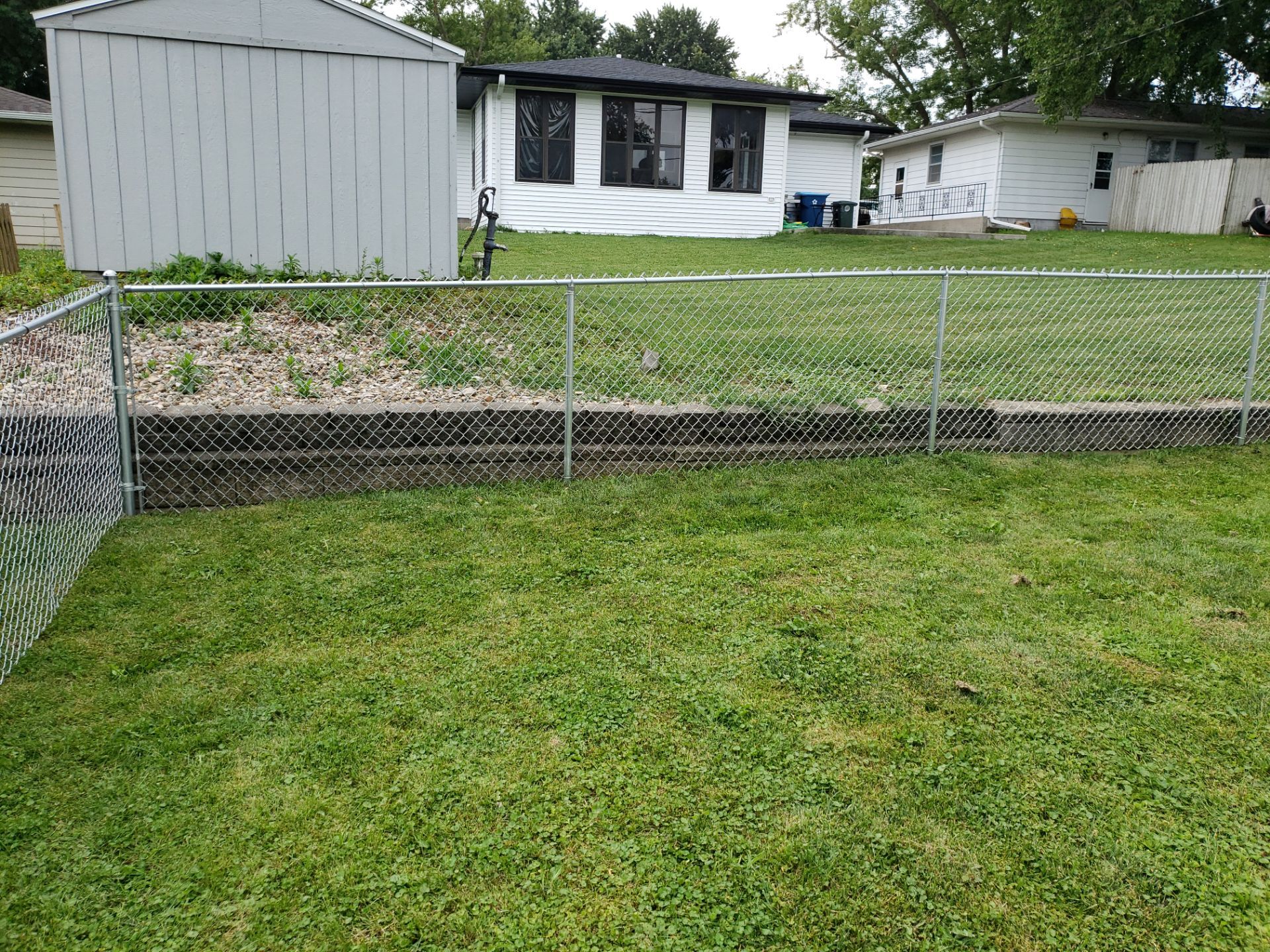 Residential Chain Link Fence and Gate Installation in Waterloo by Perfect Picket Fence and Stain