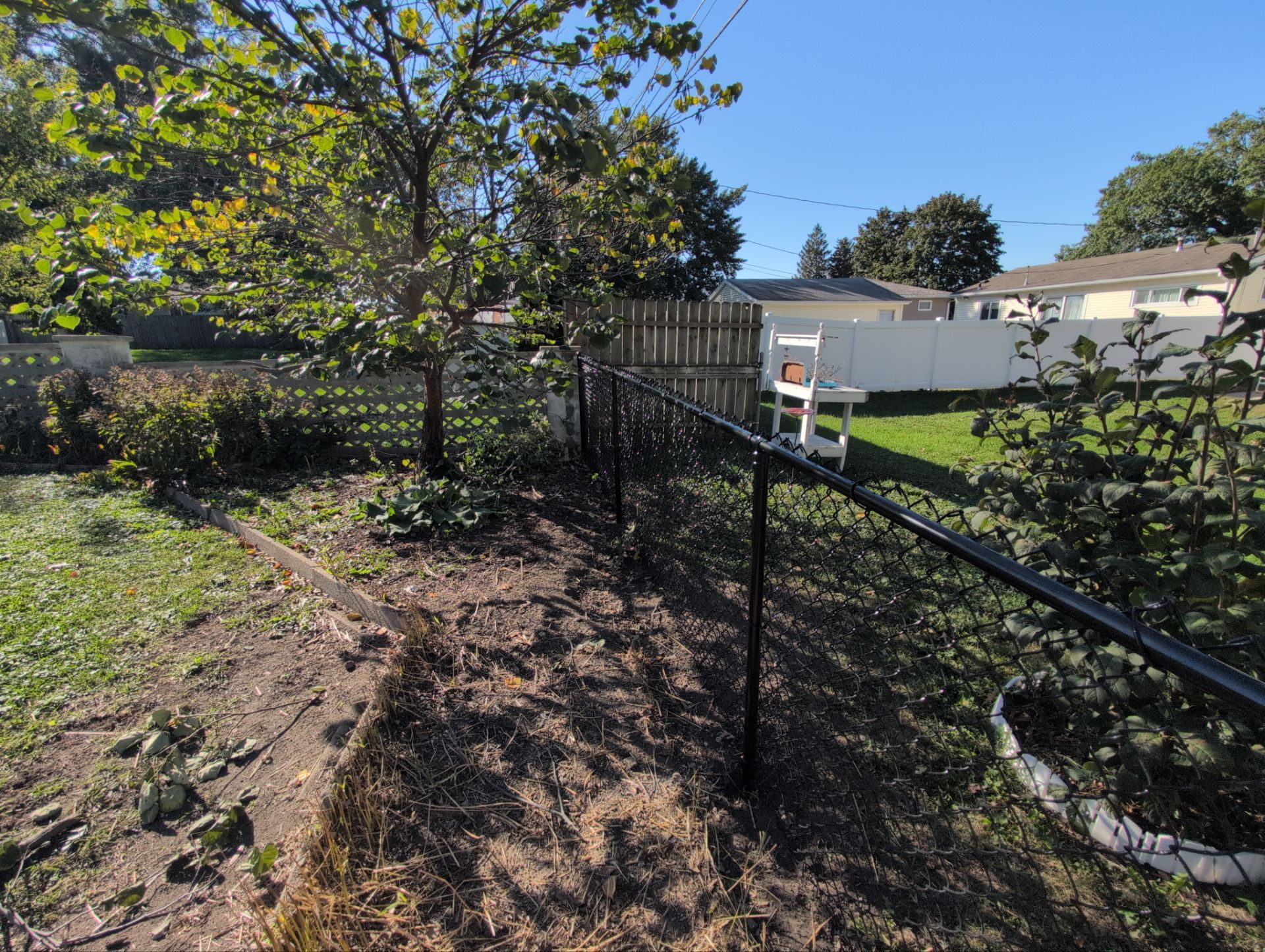 Black Chain Link Fence Installation for Waterloo Residential Property by Perfect Picket Fence and Stain
