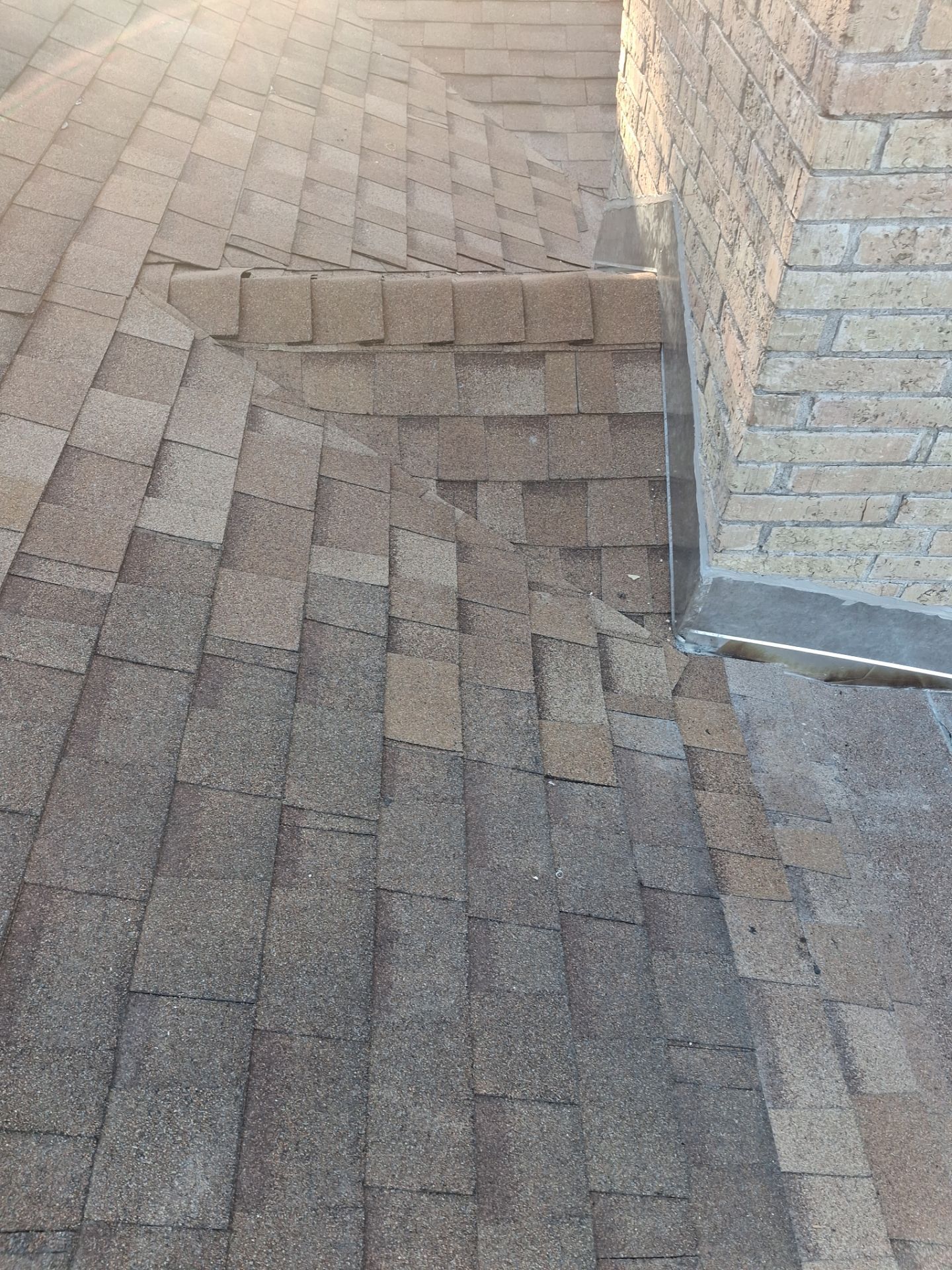 Chimneys need a Cricket.  by Bayfront Roofing and Construction