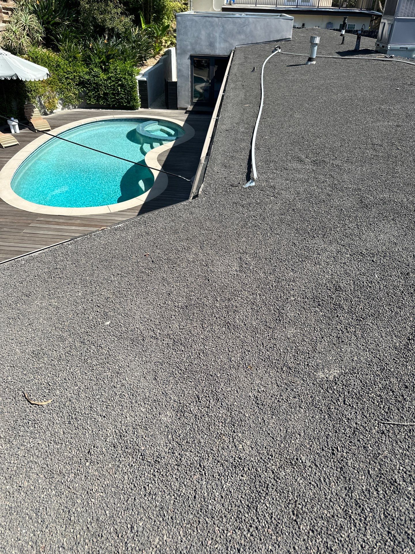 Residential Roofing Installation using Polyfresko® G Highly Reflective Modified Bitumen Cap Sheet by Hull Brothers Roofing
