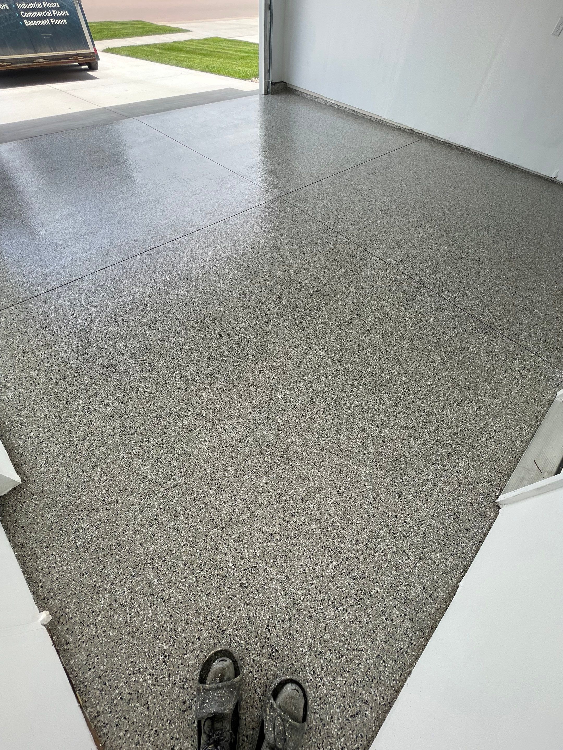 Sioux Falls Garage Floor Transformation with Cabin Fever Decorative Chips by Select Painting, Coatings & Garage Cabinets