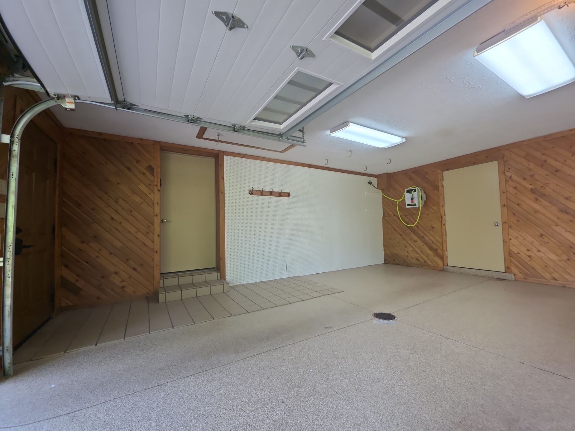 Grand Haven Garage Epoxy Floor Coating with Wax Wing Flake by Gordon Painting
