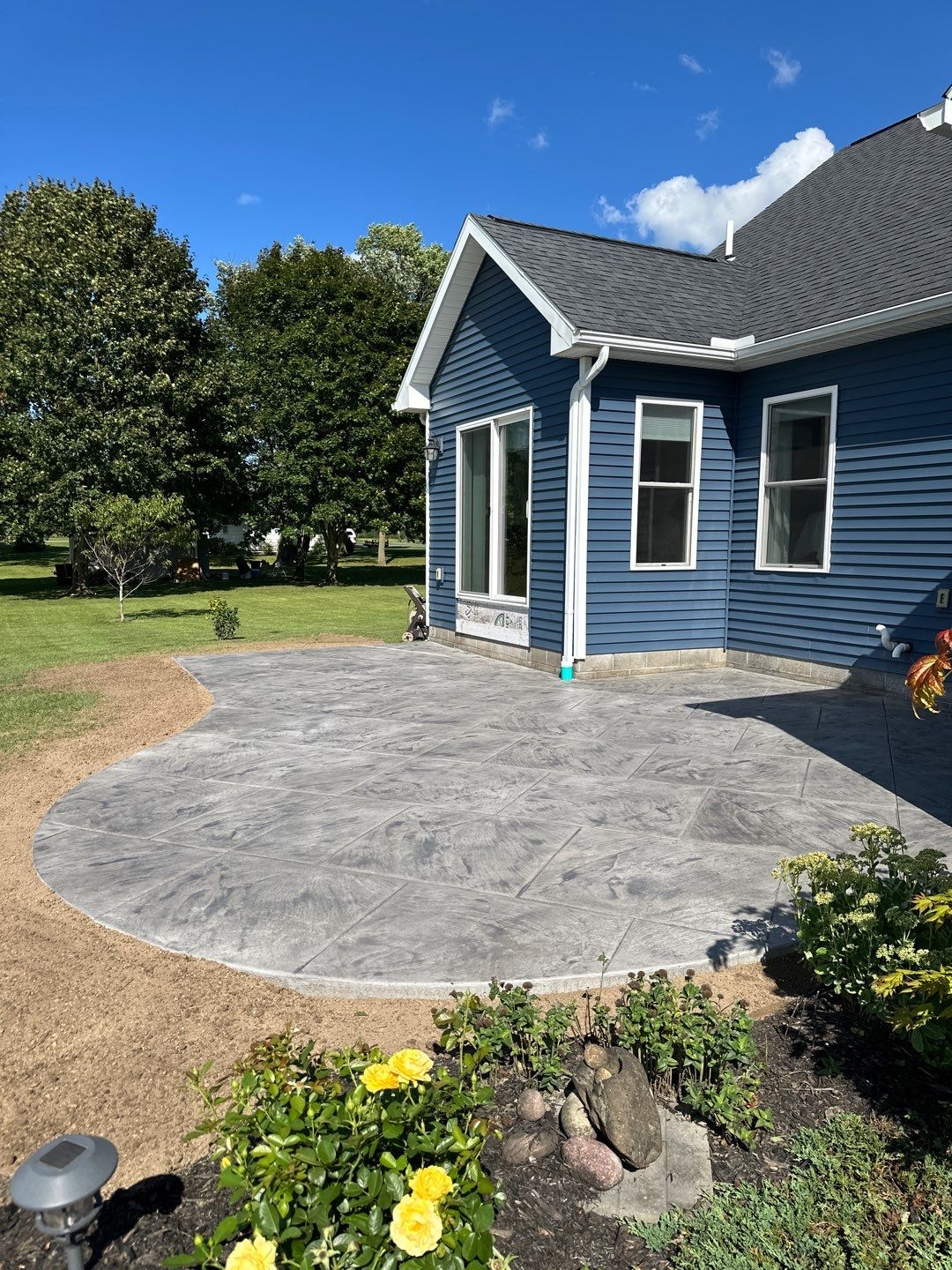 Slate stamped concrete patio  by NG Masonry & Construction LLC