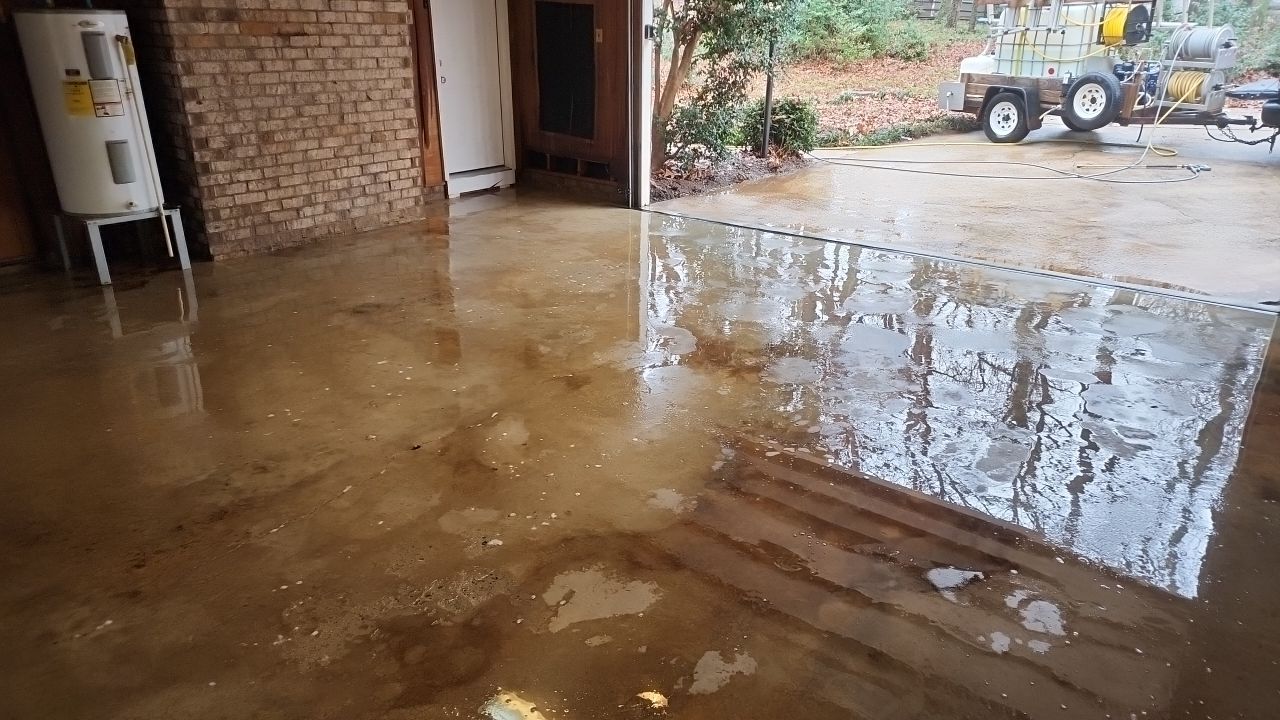 garage floor clean using cleaner by G&H Home Tech Pros LLC