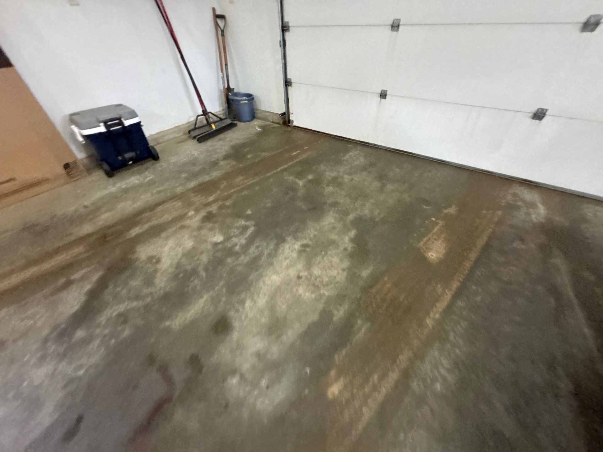 Full Garage Floor and Basement Stair Epoxy Coating in Sioux Falls by Select Painting, Coatings & Garage Cabinets