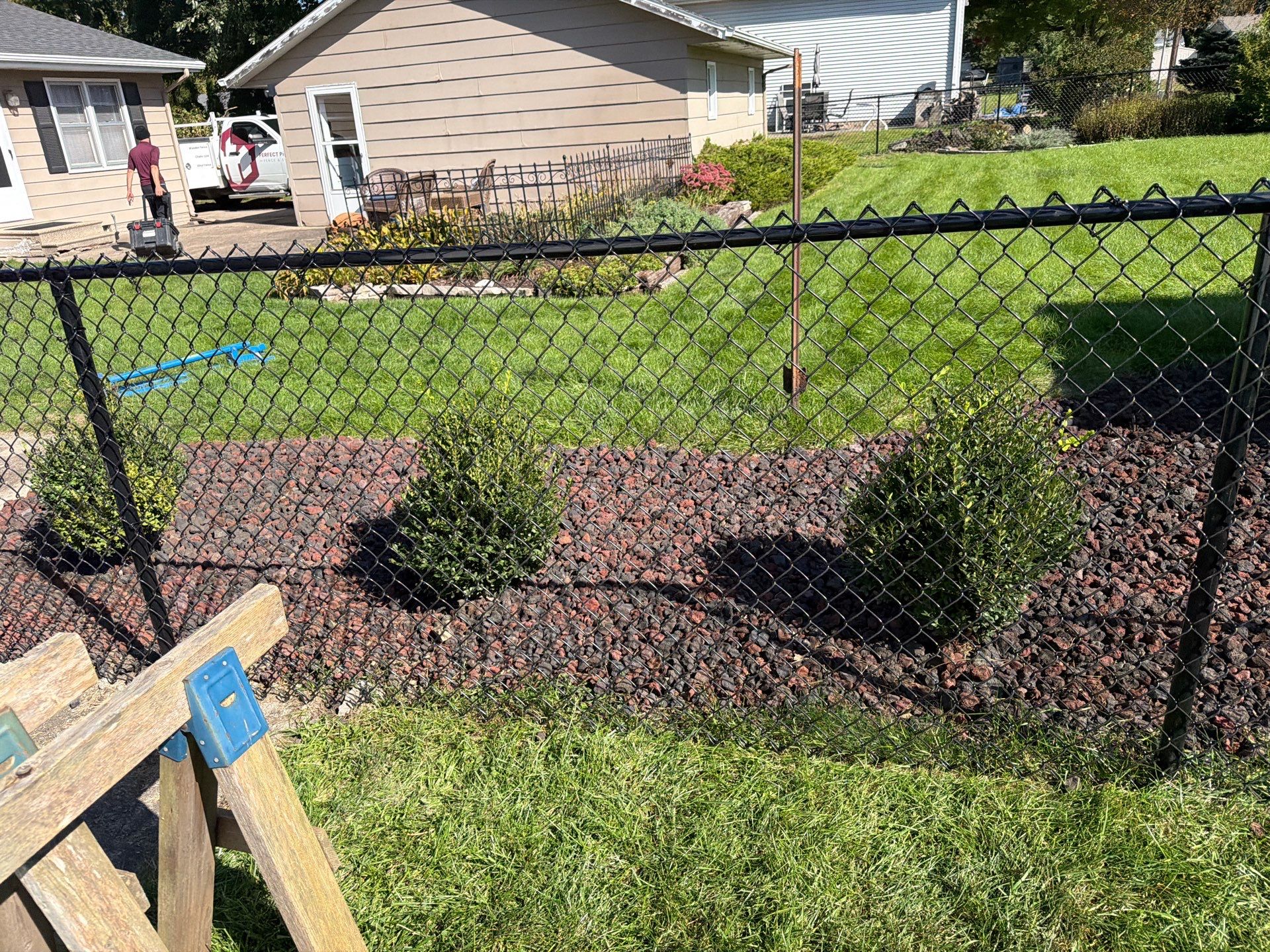 Custom Vinyl Privacy and Black Chain Link Fence Installation in Cedar Falls by Perfect Picket Fence and Stain